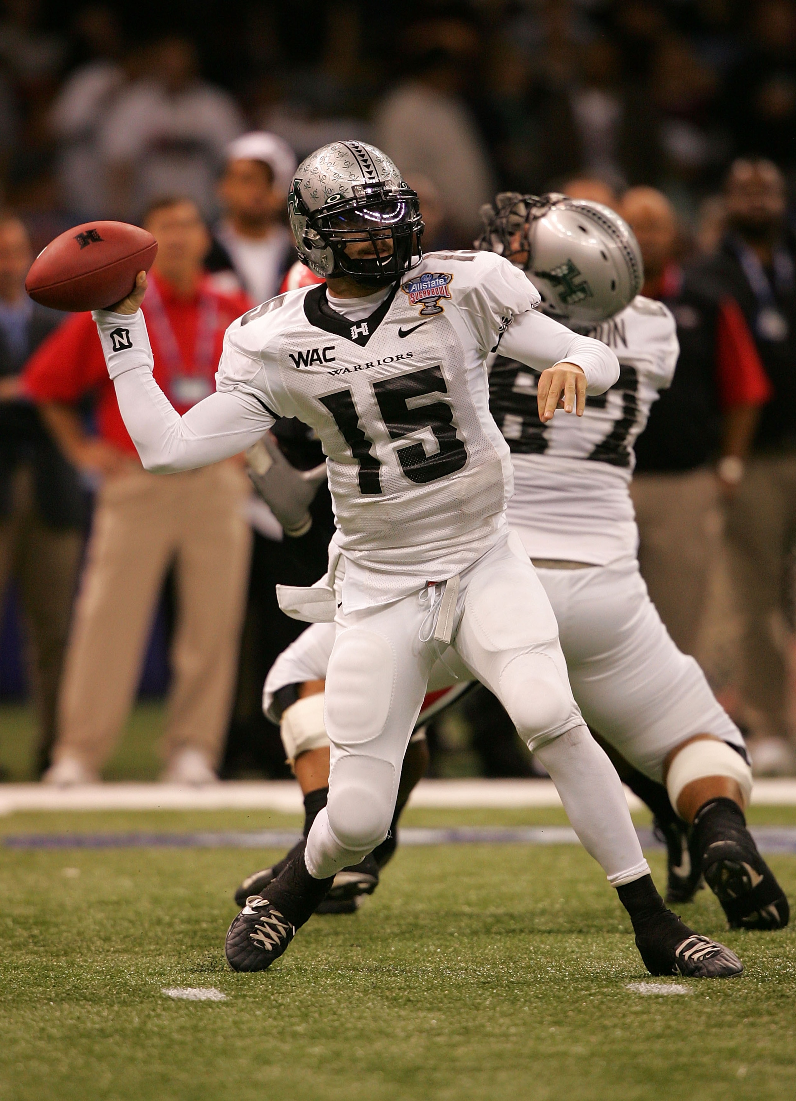 NEW ORLEANS - JANUARY 01:  Quarterback Colt Brennan #15 of the Hawai'i Warriors throws a pass against the Georgia Bulldogs during the Allstate Sugar Bowl at the Louisiana Superdome on January 1, 2008 in New Orleans, Louisiana.  (Photo by Matthew Stockman/