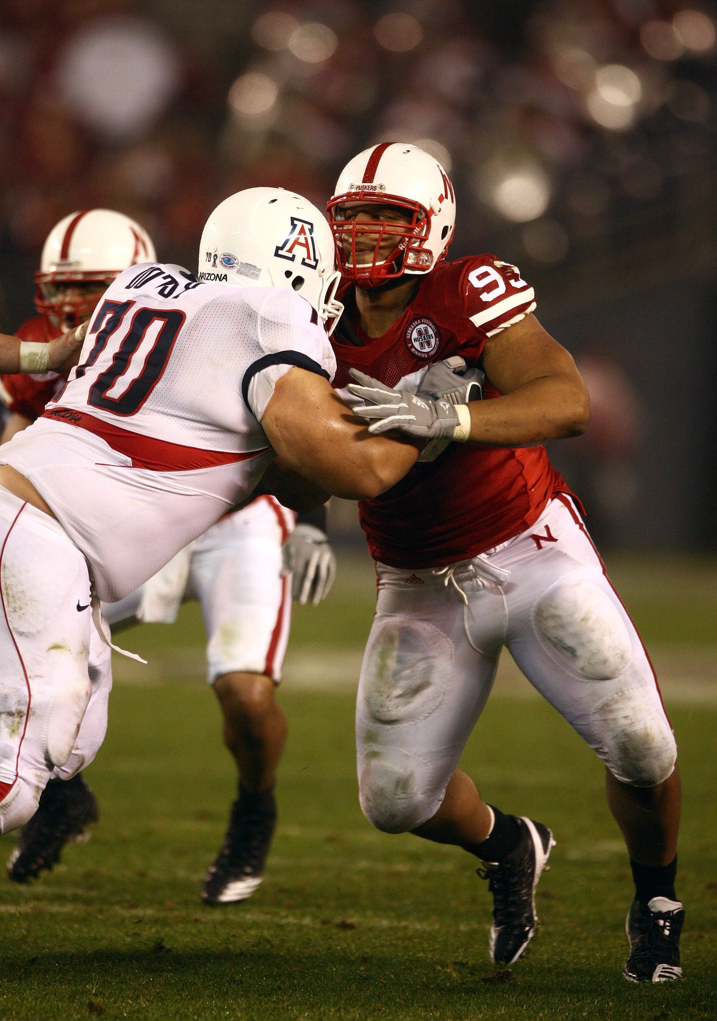 SAN DIEGO - DECEMBER 30:  Ndamukong Suh #93 of the University of Nebraska Cornhuskers engages an offensive lineman in a block during the Pacific Life Holiday Bowl against University of Arizona Wildcats on December 30, 2009 at Qualcomm Stadium in San Diego