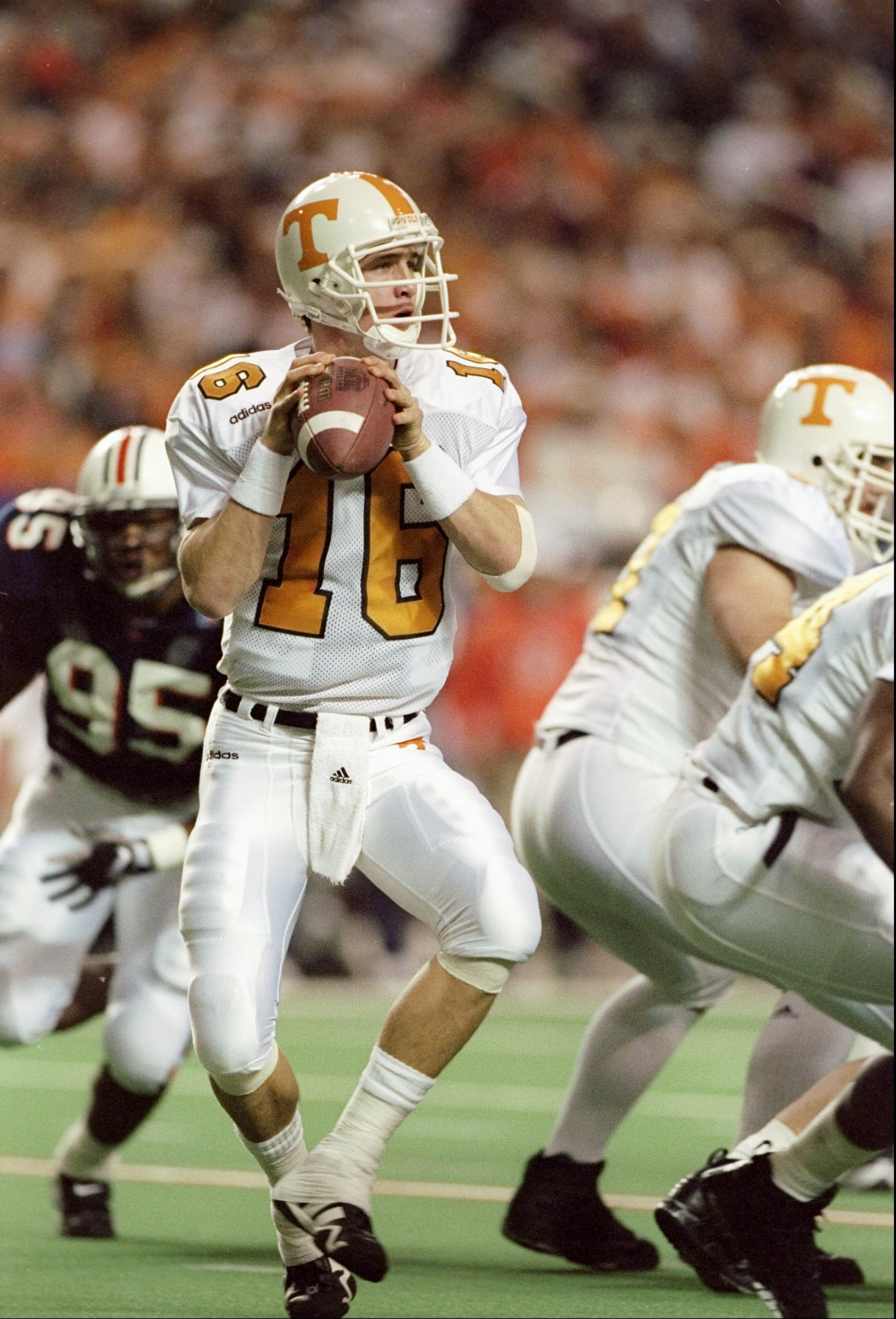 6 Dec 1997: Quarterback Peyton Manning #16 of Tennessee drops back to pass during the Volunteers 30-29 win over Auburn in the SEC Championship at the Georgia Dome in Atlanta, Georgia.