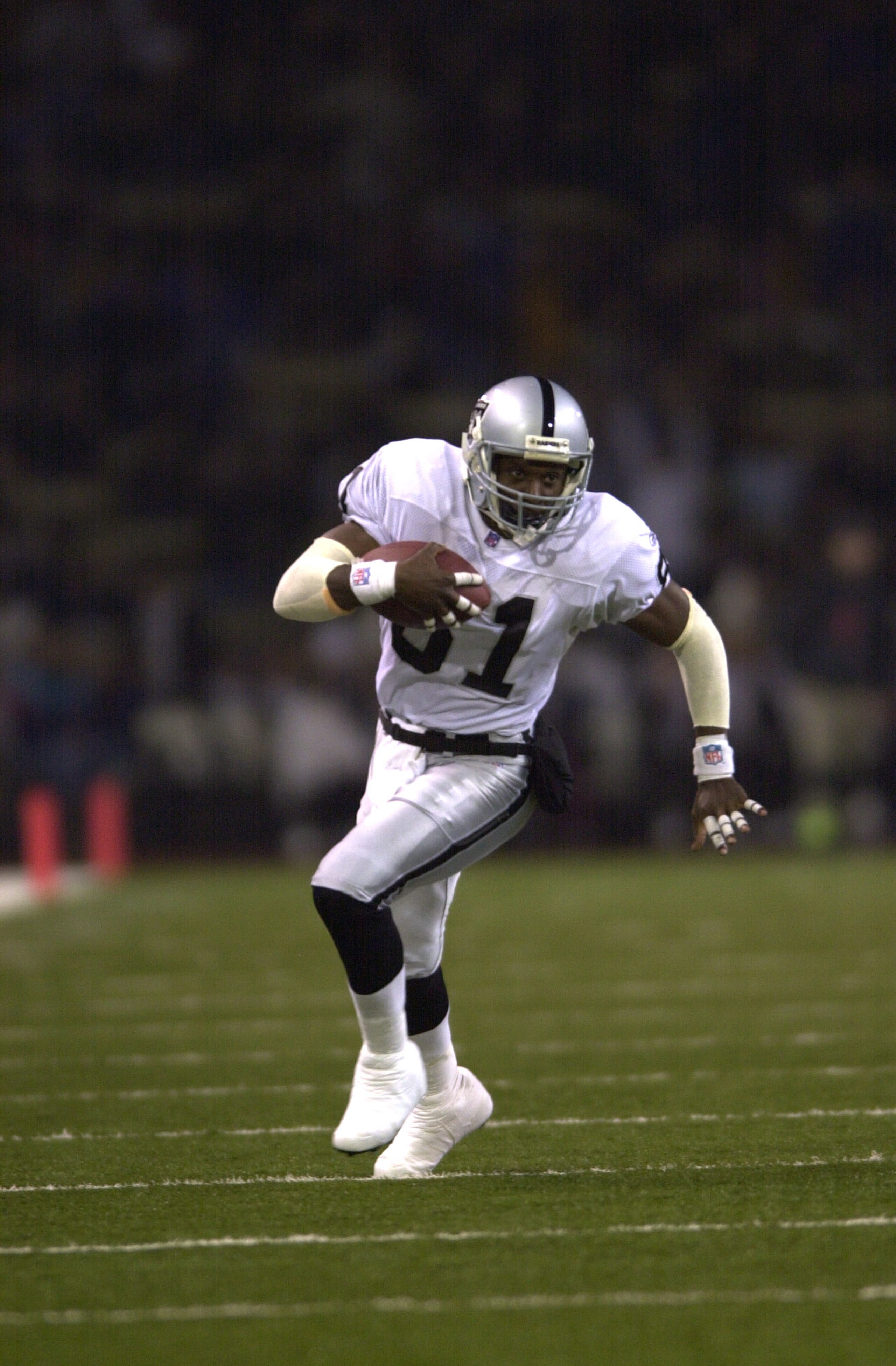 11 Nov 2001 : Tim Brown of the Oakland Raiders gains yardage against the Seattle Seahawks during the game at Husky Stadium in Seattle, Washington. The Seattle Seahawks beat the Oakland Raiders 34-27. DIGITAL IMAGE. Mandatory Credit: Otto Greule/Allsport