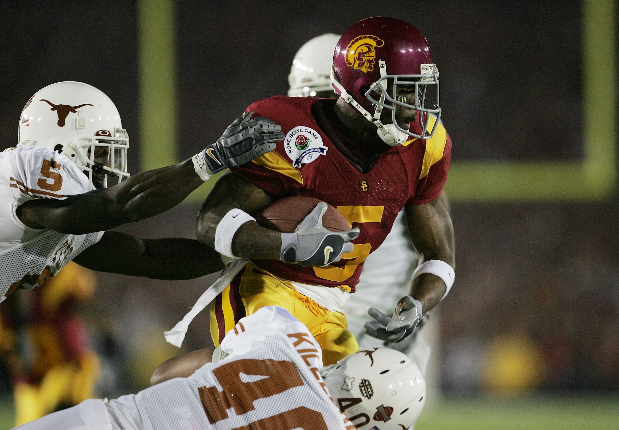 PASADENA, CA - JANUARY 04:  Running back Reggie Bush #5 of the USC Trojans returns the kick-off to start the game against the Texas Longhorns during the BCS National Championship Rose Bowl Game on January 4, 2006 in Pasadena, California.  (Photo by Stephe
