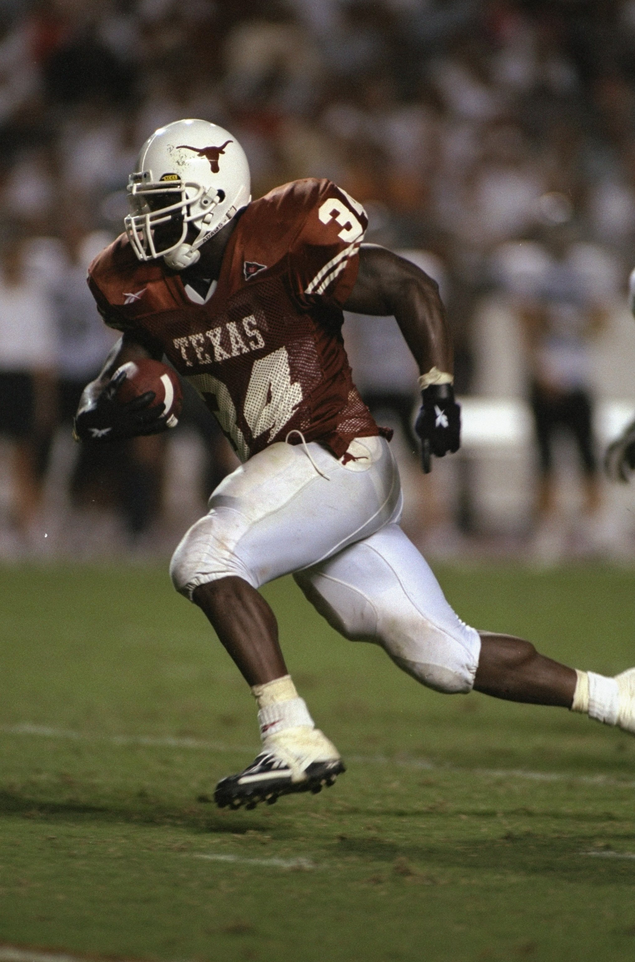 26 Sep 1998: Running back Ricky Williams #34 of the Texas Longhorns in action during the game against the Rice Owls at the Texas Memorial Stadium in Austin, Texas. The Longhorns defeated the Owls 59-21. Mandatory Credit: Chris Covatta /Allsport