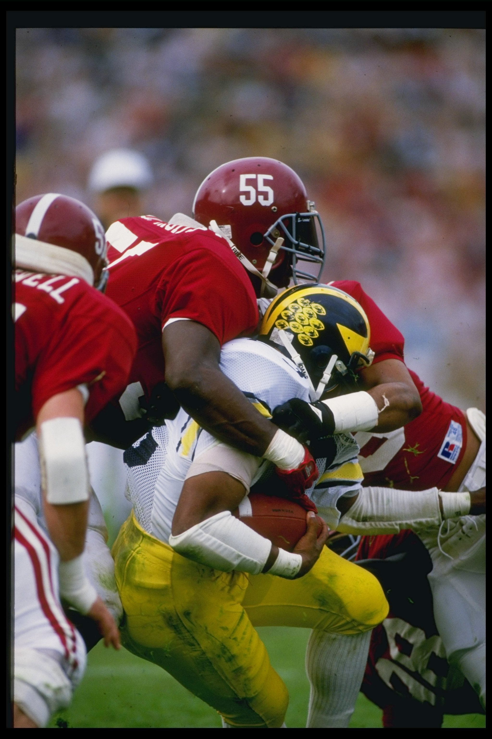 Linebacker Derrick Thomas of the Alabama Crimson Tide makes a tackle during a game against the Michigan Wolverines at Byrant Denny Stadium in Tuscawosa, Alabama.