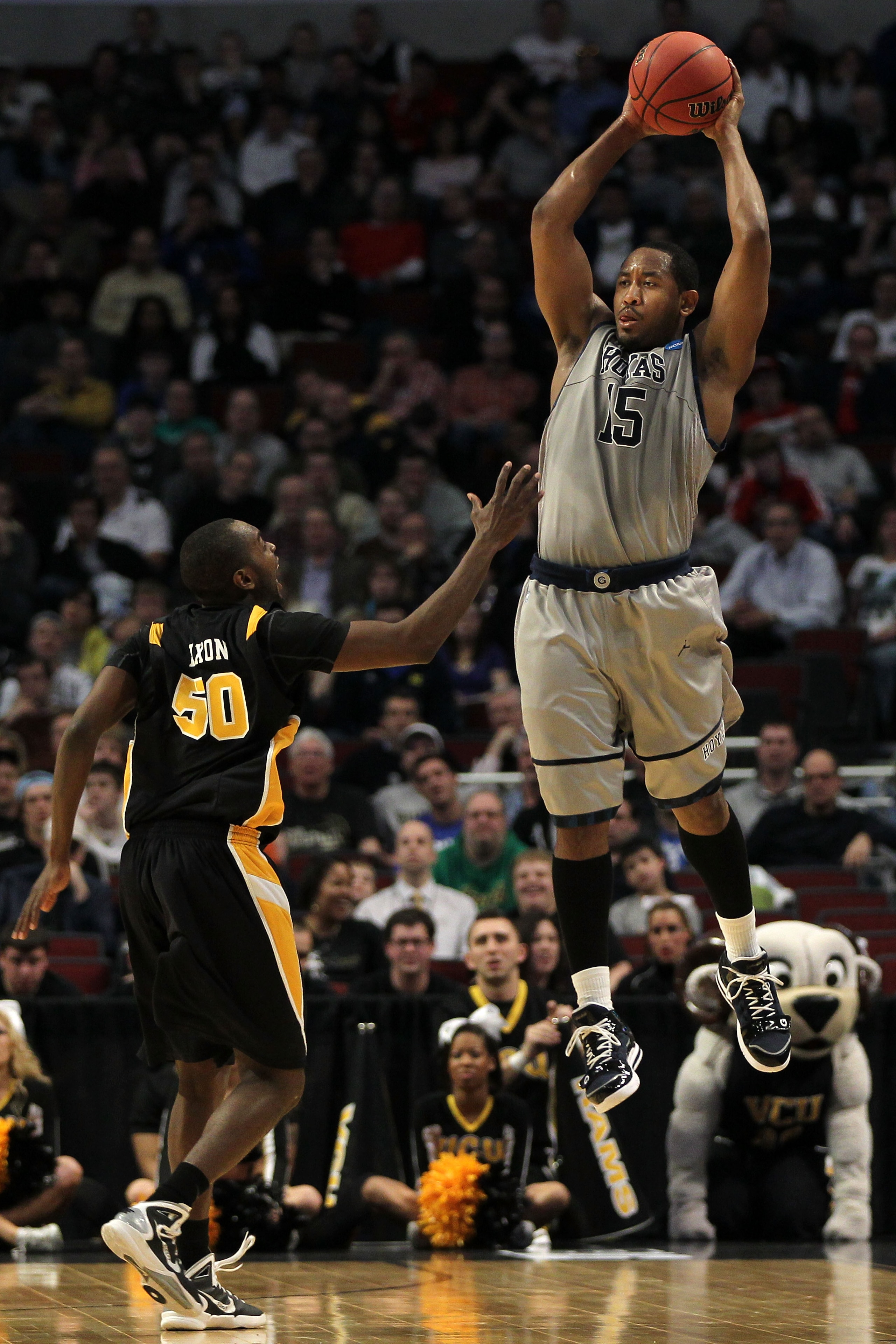 CHICAGO, IL - MARCH 18: Austin Freeman #15 of the Georgetown Hoyas looks to pass against Ed Nixon #50 of the Virginia Commonwealth Rams in the first half during the second round of the 2011 NCAA men's basketball tournament at the United Center on March 18 CHICAGO, IL - MARCH 18: Austin Freeman #15 of the Georgetown Hoyas looks to pass against Ed Nixon #50 of the Virginia Commonwealth Rams in the first half during the second round of the 2011 NCAA men's basketball tournament at the United Center on March 18