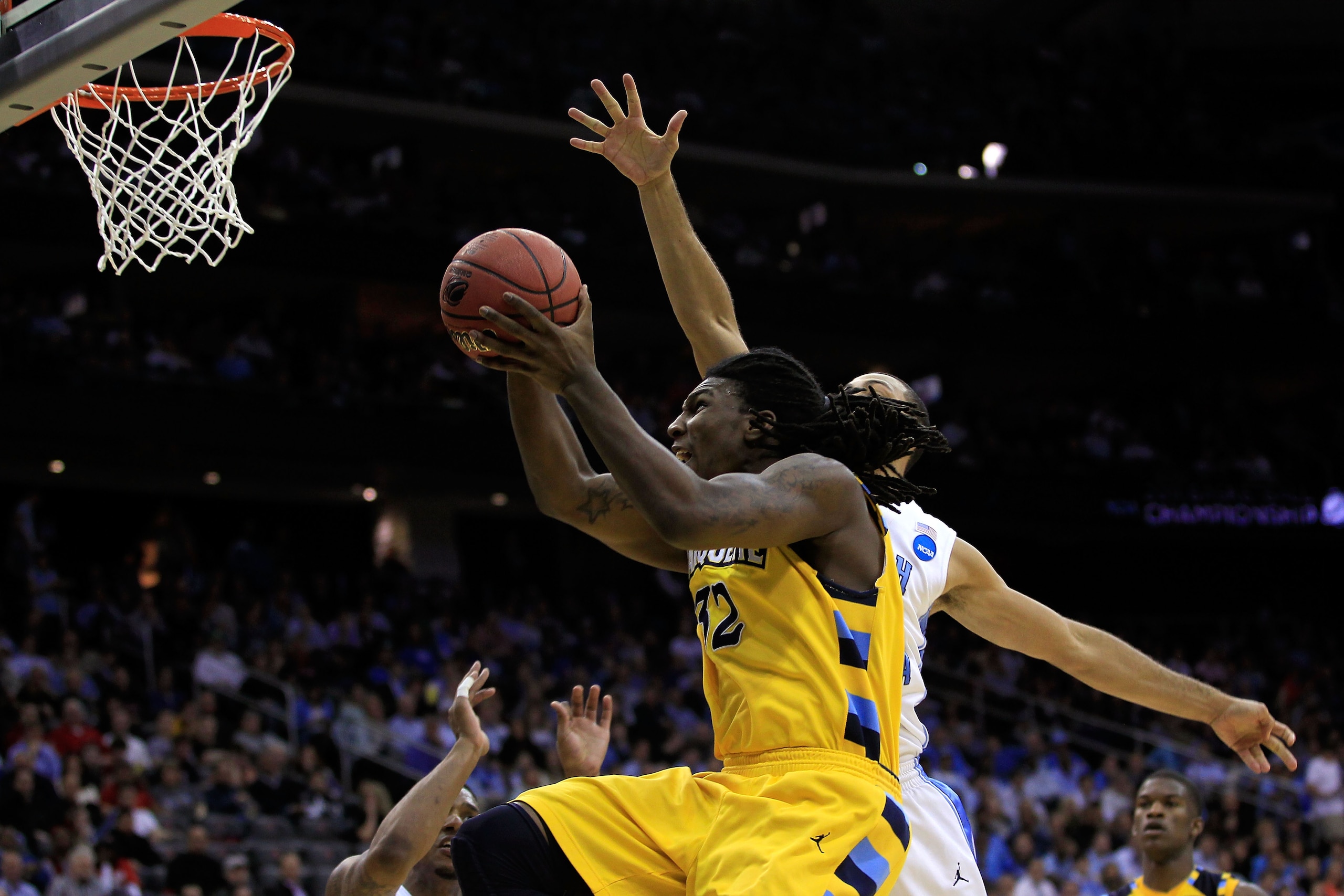 NEWARK, NJ - MARCH 25: Jae Crowder #32 of the Marquette Golden Eagles in action against the North Carolina Tar Heels during the east regional semifinal of the 2011 NCAA Men's Basketball Tournament at the Prudential Center on March 25, 2011 in Newark, New NEWARK, NJ - MARCH 25: Jae Crowder #32 of the Marquette Golden Eagles in action against the North Carolina Tar Heels during the east regional semifinal of the 2011 NCAA Men's Basketball Tournament at the Prudential Center on March 25, 2011 in Newark, New