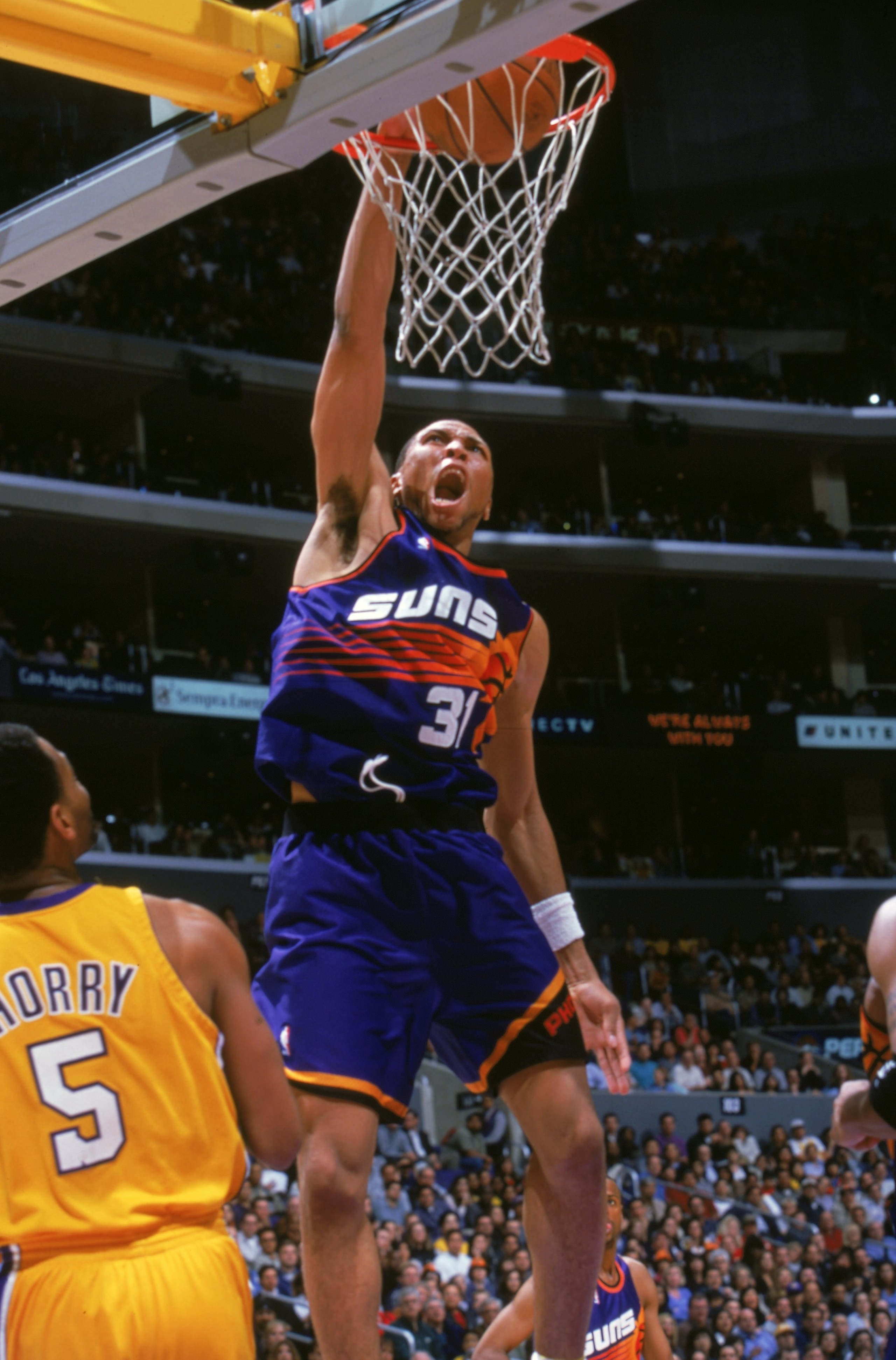 24 Mar 2000: Shawn Marion #31 of the Phoenix Suns makes a slam dunk during a game against the Los Angeles Lakers at the Staples Center in Los Angeles, California. The Lakers defeated the Suns 109-101.       Mandatory Credit: Stephen Dunn  /Allsport