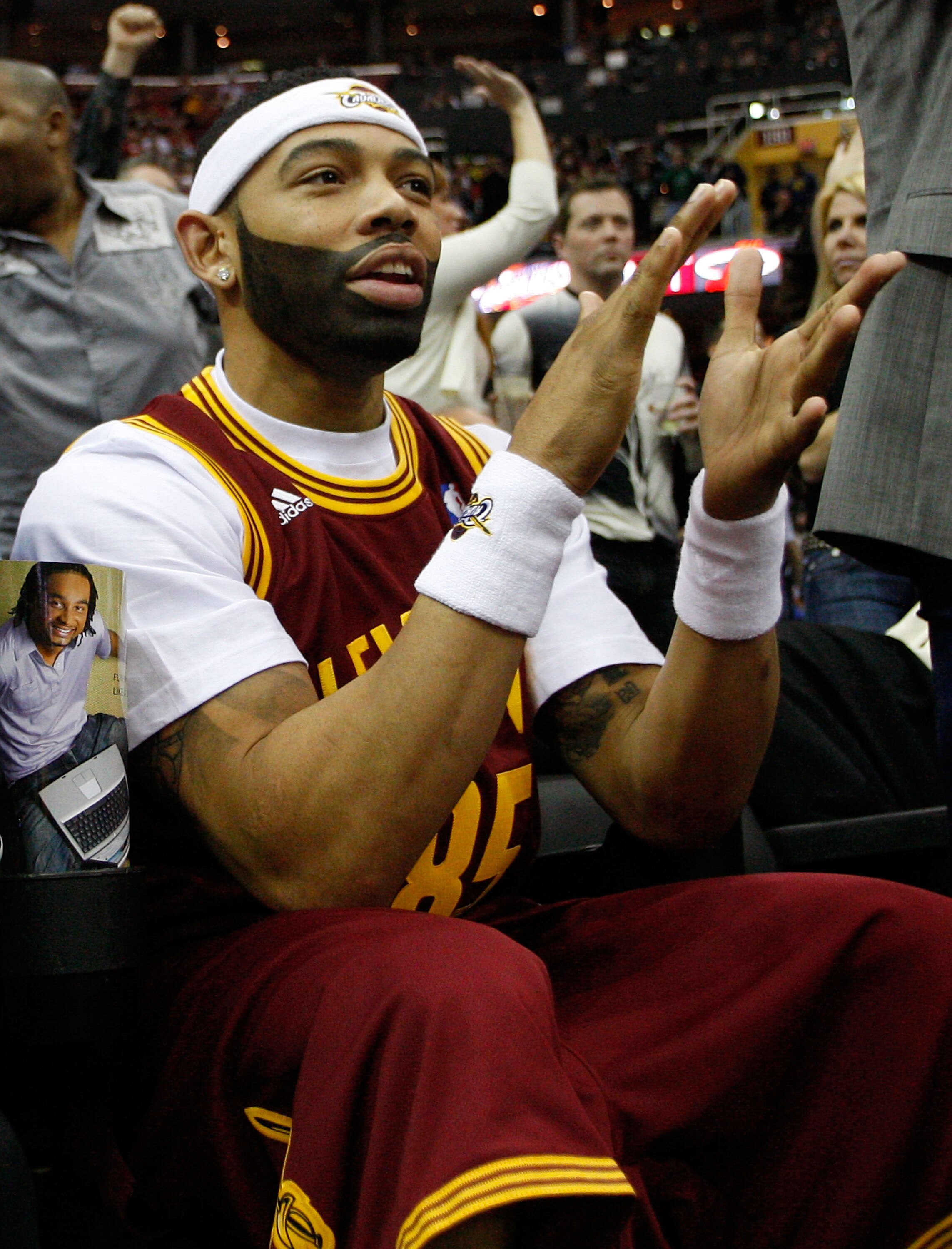 CLEVELAND - MARCH 29: Joe Haden of the Cleveland Browns cheers on the Cleveland Cavaliers during the game against the Miami Heat on March 29, 2011 at Quicken Loans Arena in Cleveland, Ohio. NOTE TO USER: User expressly acknowledges and agrees that, by dow CLEVELAND - MARCH 29: Joe Haden of the Cleveland Browns cheers on the Cleveland Cavaliers during the game against the Miami Heat on March 29, 2011 at Quicken Loans Arena in Cleveland, Ohio. NOTE TO USER: User expressly acknowledges and agrees that, by dow