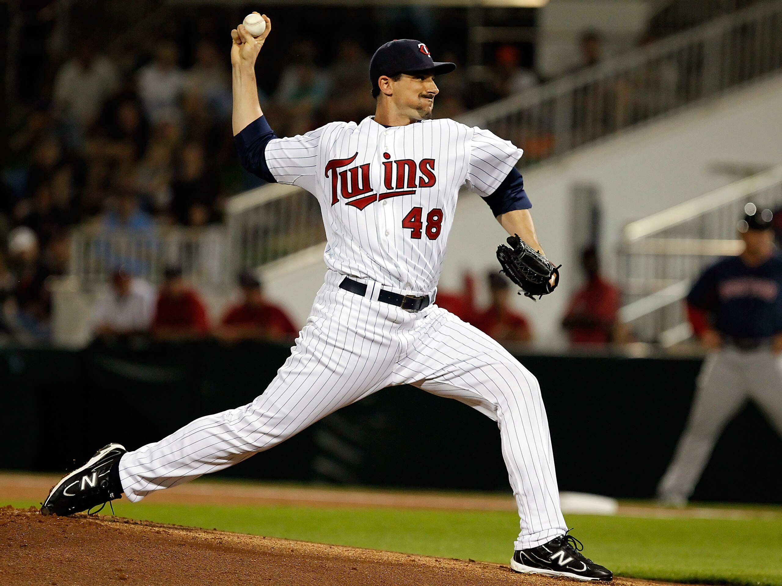 FORT MYERS, FL - FEBRUARY 27:  Pitcher Carl Pavano #48 of the Minnesota Twins pitches against the Boston Red Sox during a Grapefruit League Spring Training Game at Hammond Stadium on February 27, 2011 in Fort Myers, Florida.  (Photo by J. Meric/Getty Imag