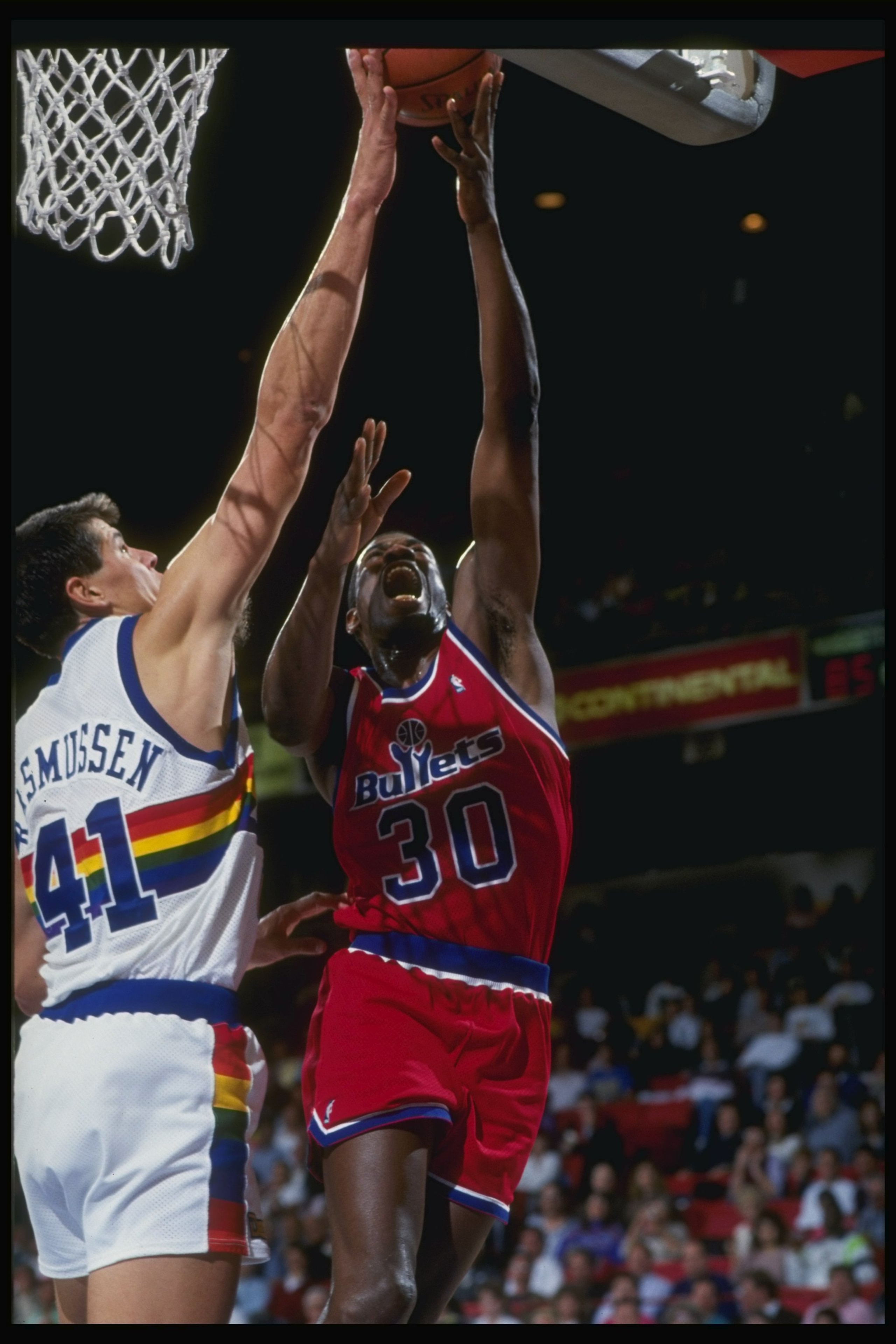 1990-1991:  Forward Bernard King of the Washington Bullets (right) goes up against center Blair Rasmussen of the Denver Nuggets during a game at the McNichols Arena in Denver Colorado. Mandatory Credit: Tim de Frisco  /Allsport
