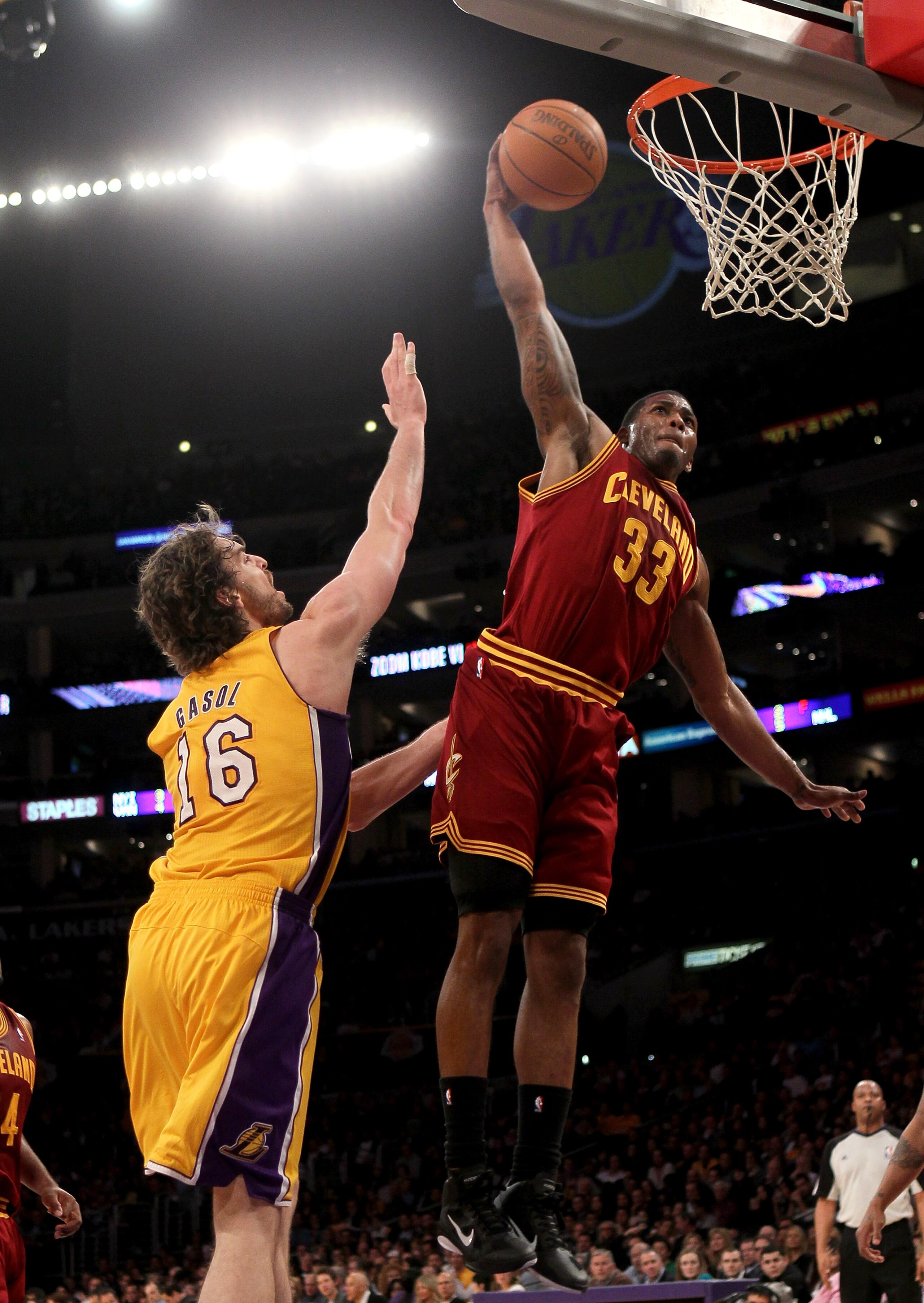 LOS ANGELES, CA - JANUARY 11:  Alonzo Gee #33 of the Cleveland Cavaliers dunks over Pau Gasol #16 of the Los Angeles Lakers at Staples Center on January 11, 2011 in Los Angeles, California.  The Lakers won 112-57.  NOTE TO USER: User expressly acknowledge