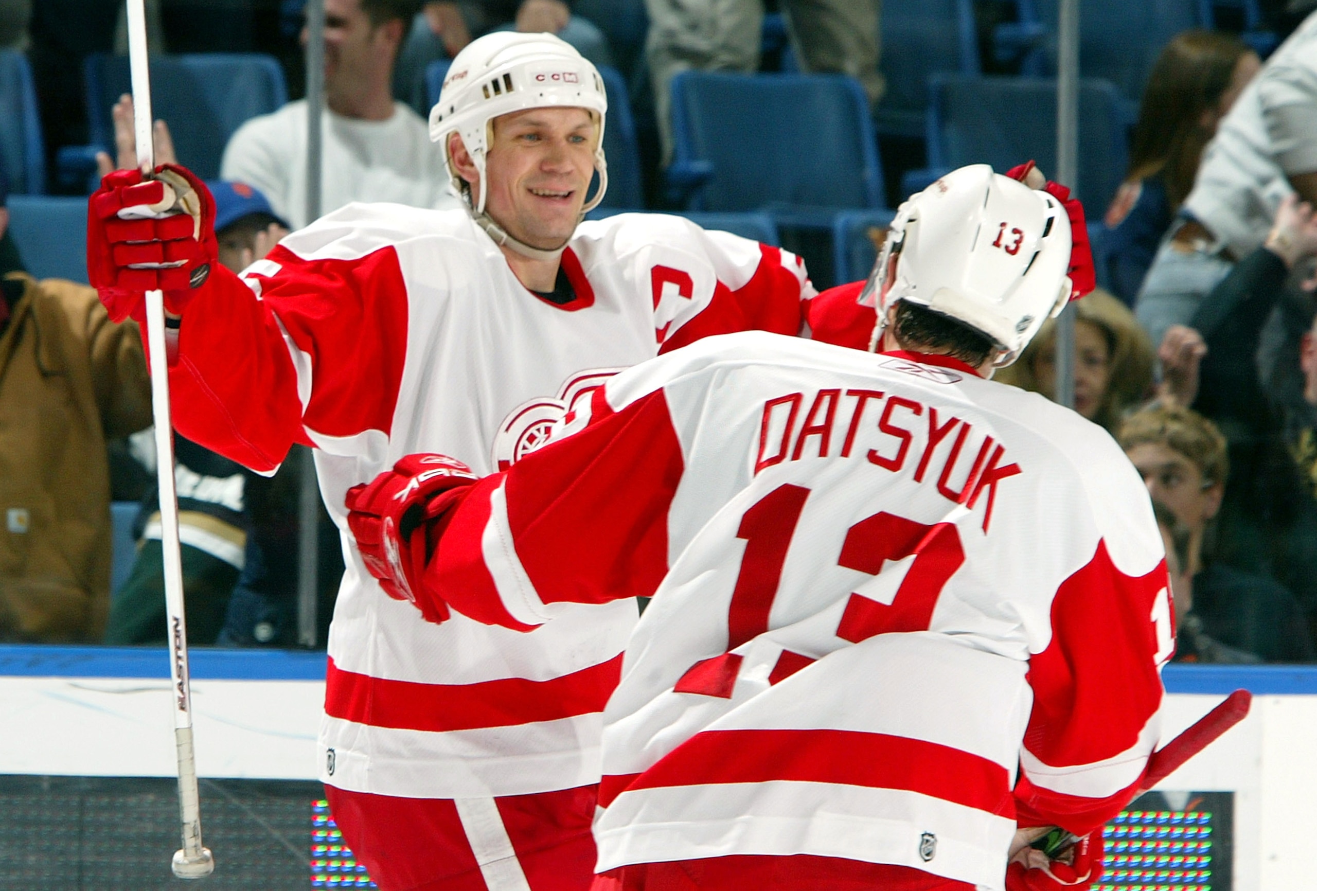 UNIONDALE, NY - JANUARY 30:  Nicklas Lidstrom #5 of the Detroit Red Wings celebrates with Pavel Datsyuk #13 after assisting on teammate Henrik Zetterberg's (not pictured) overtime goal against the New York Islanders on January 30, 2007 at Nassau Coliseum 