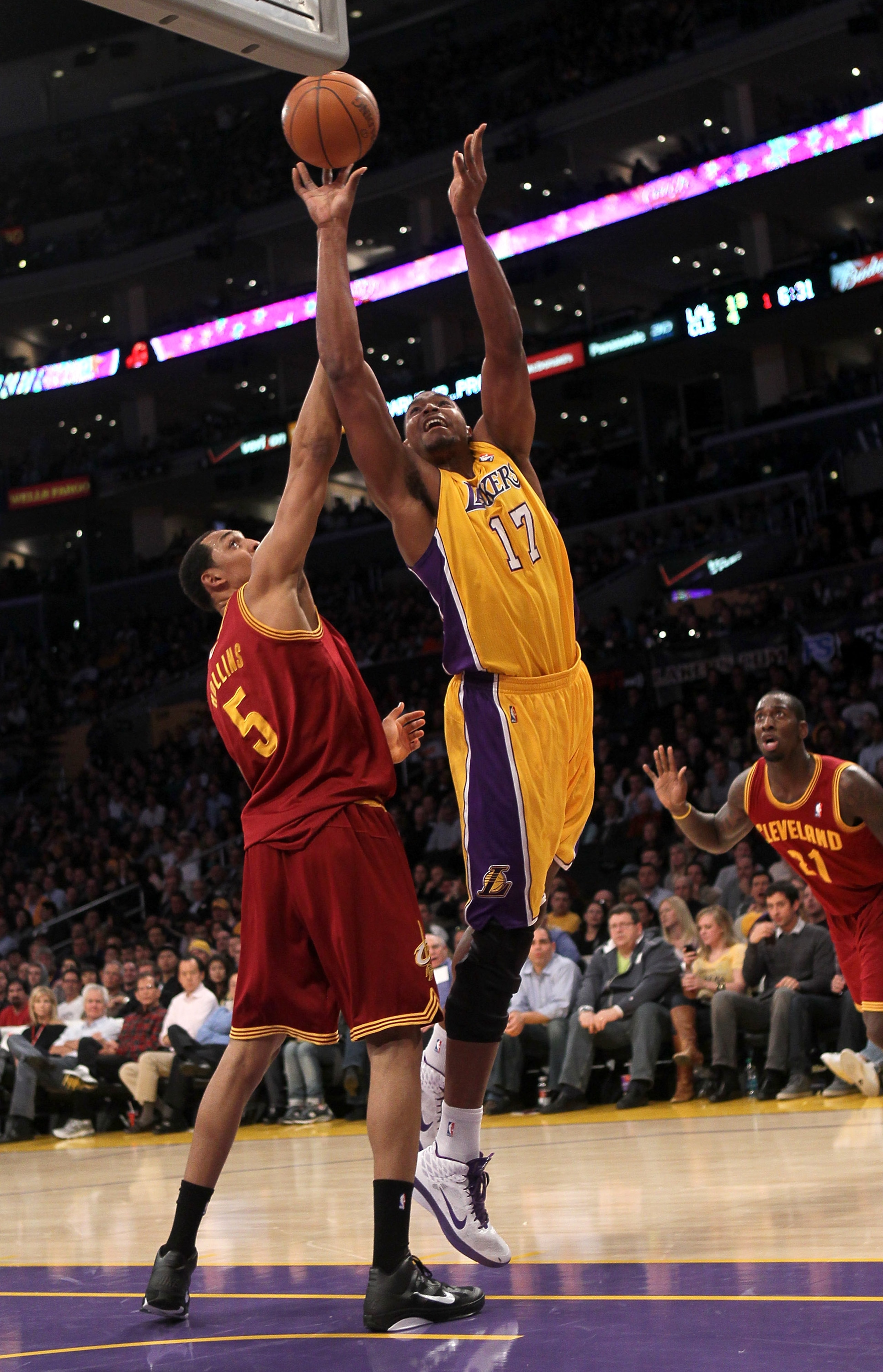 LOS ANGELES, CA - JANUARY 11:  Andrew Bynum #17 of the Los Angeles Lakers shoots over Ryan Hollins #5 the Cleveland Cavaliers at Staples Center on January 11, 2011 in Los Angeles, California.  The Lakers won 112-57.  NOTE TO USER: User expressly acknowled