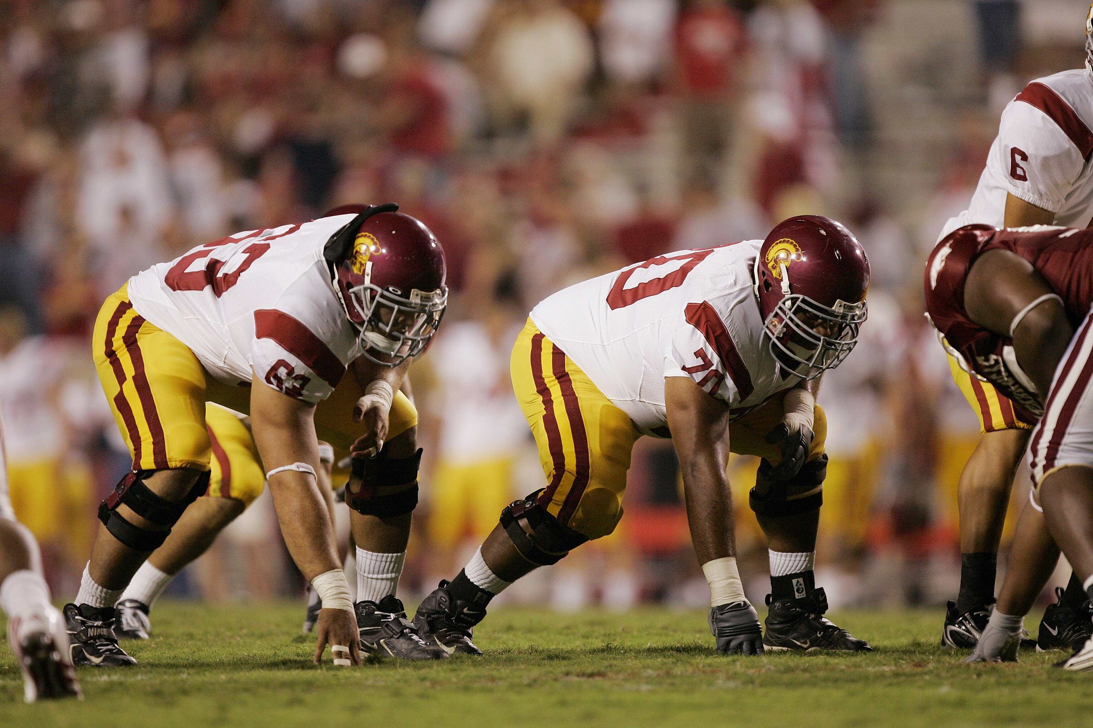 FAYETTEVILLE, AR - SEPTEMBER 2:  Travis Draper #63 of the University of Southern California Trojansand  Alatini Malu #70 line up on the offensive line against the Arkansas Razorbacks on September 2, 2006 at Donald W. Reynolds Razorback Stadium in Fayettev