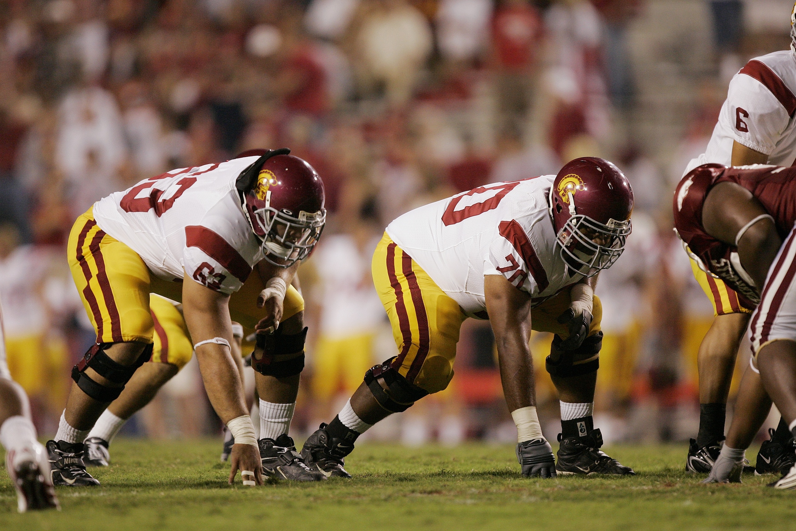 FAYETTEVILLE, AR - SEPTEMBER 2:  Travis Draper #63 of the University of Southern California Trojansand  Alatini Malu #70 line up on the offensive line against the Arkansas Razorbacks on September 2, 2006 at Donald W. Reynolds Razorback Stadium in Fayettev