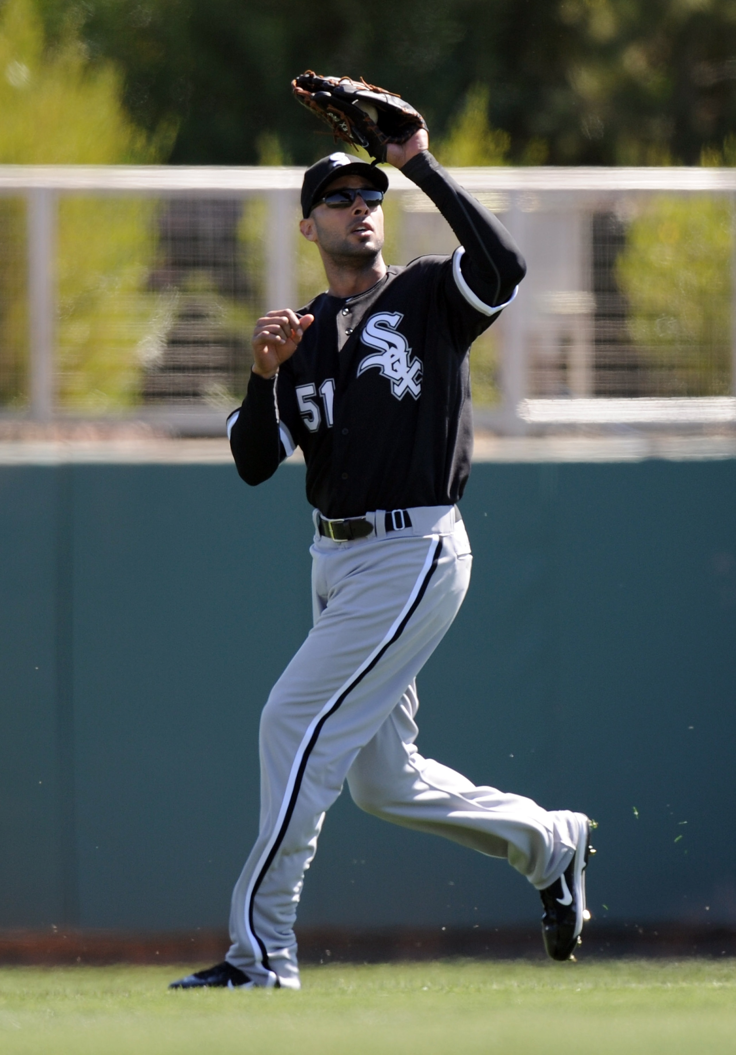 PHOENIX, AZ - FEBRUARY 28:  Alex Rios #51 of the Chicago White Sox makes a catch against the Los Angeles Dodgers during spring training at Camelback Ranch on February 28, 2011 in Phoenix, Arizona.  (Photo by Harry How/Getty Images)