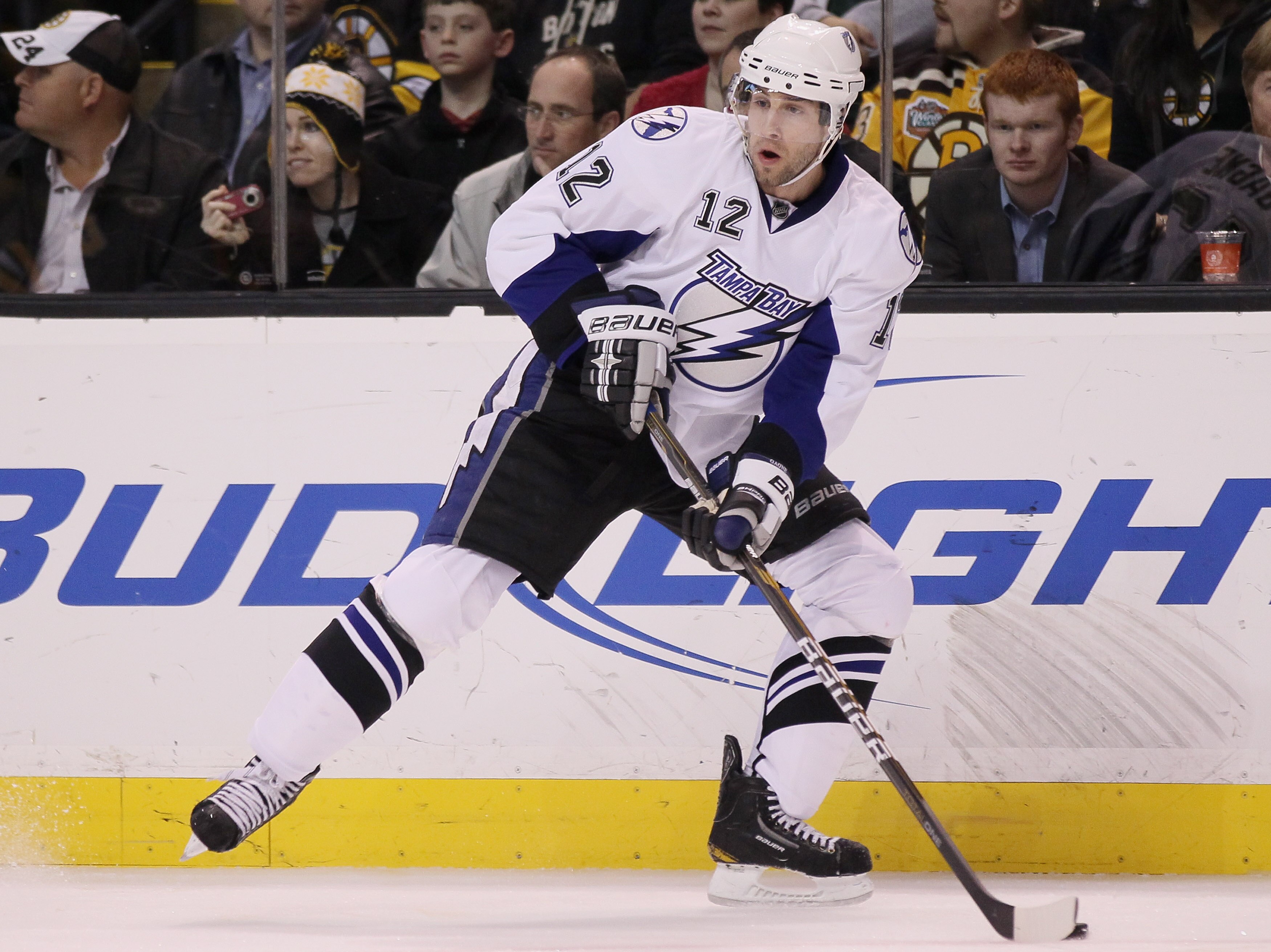 BOSTON, MA - MARCH 03:  Simon Gagne #12 of the Tampa Bay Lightning looks to pass in the second period against the Boston Bruins on March 3, 2011 at the TD Garden in Boston, Massachusetts.  (Photo by Elsa/Getty Images)