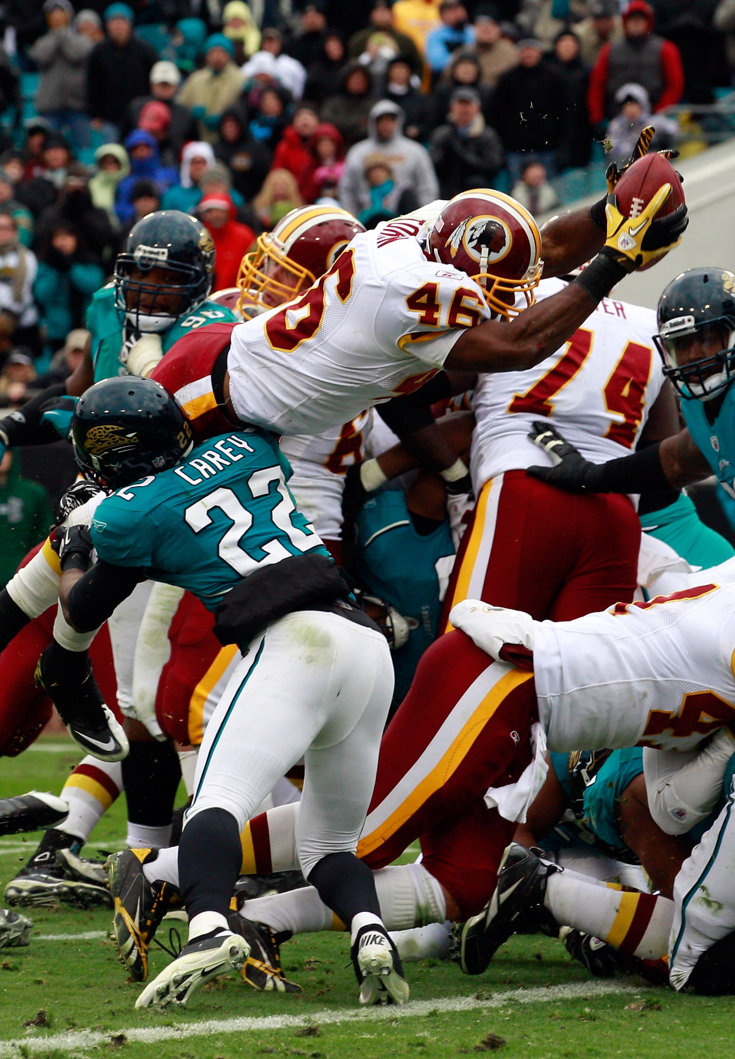 JACKSONVILLE, FL - DECEMBER 26:  Ryan Torain #46 of the Washington Redskins dives for a touchdown over Don Carey #22 of the Jacksonville Jaguars during the game at EverBank Field on December 26, 2010 in Jacksonville, Florida.  (Photo by Sam Greenwood/Gett