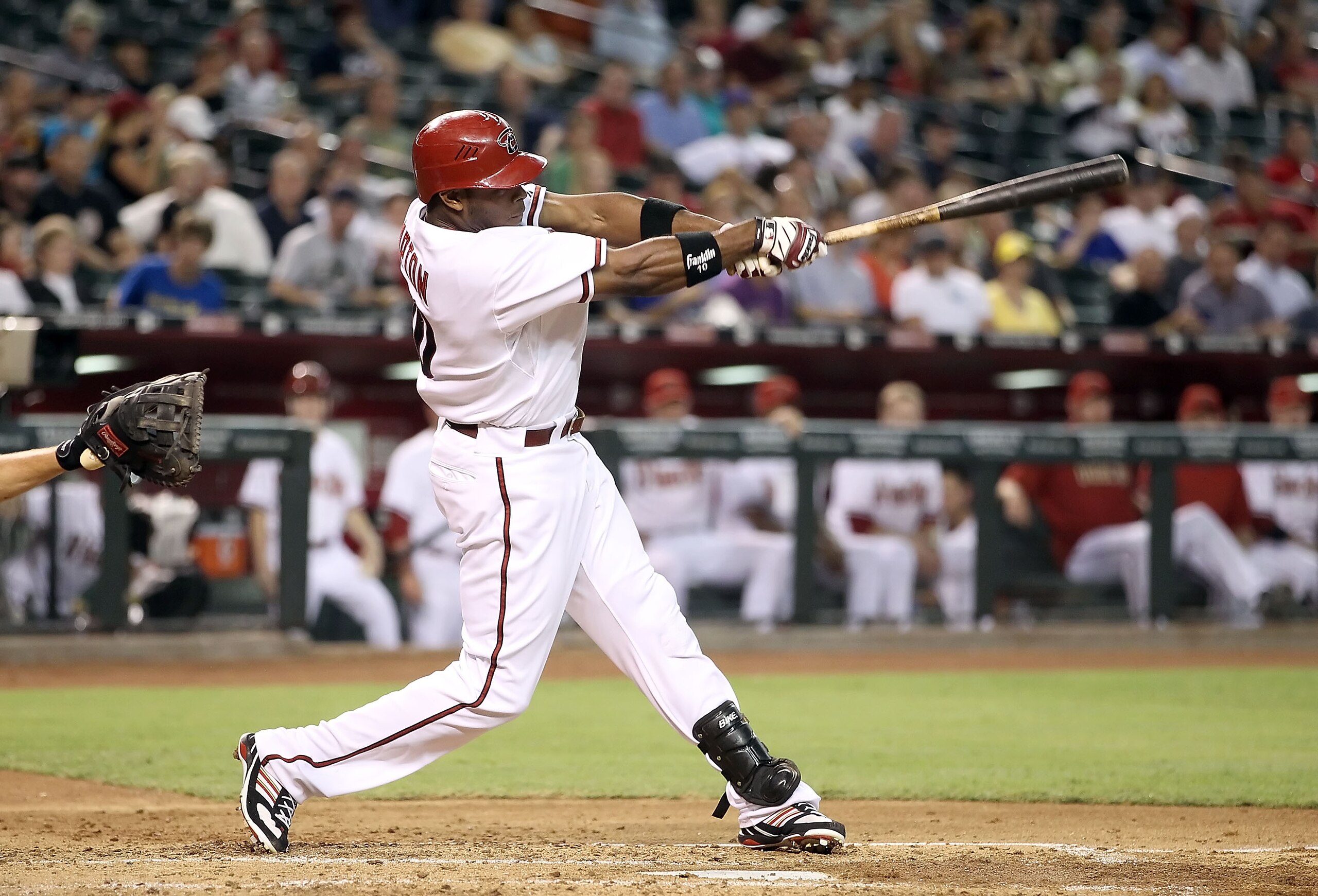 PHOENIX - JULY 20:  Justin Upton #10 of the Arizona Diamondbacks hits a solo home run against the New York Mets during the thrid inning of the Major League Baseball game at Chase Field on July 20, 2010 in Phoenix, Arizona.  (Photo by Christian Petersen/Ge