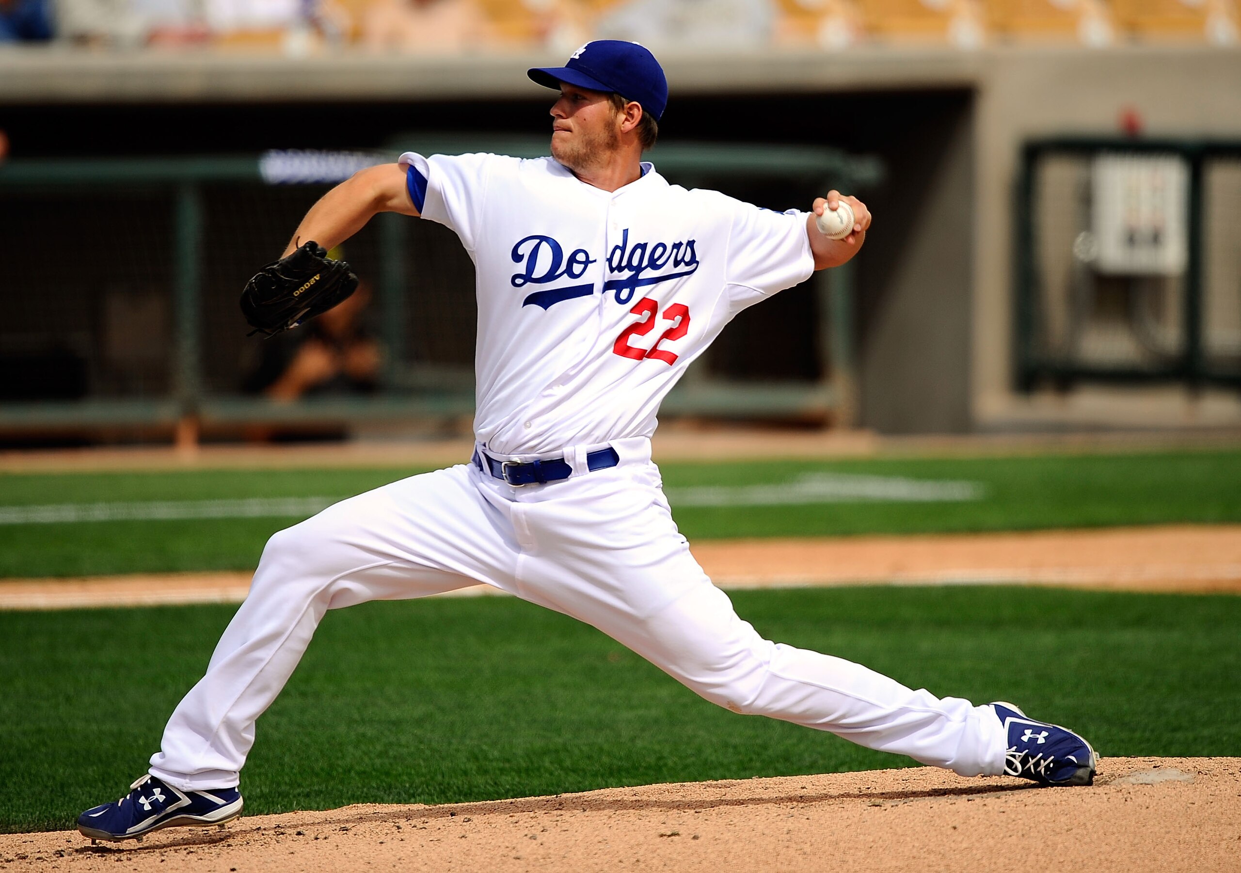 GLENDALE, AZ - MARCH 15:  Pitcher Clayton Kershaw #22 of the Los Angeles Dodgers throws a pitch against Texas Rangers during the spring training baseball game at Camelback Ranch on March 15, 2011 in Glendale, Arizona.  (Photo by Kevork Djansezian/Getty Im