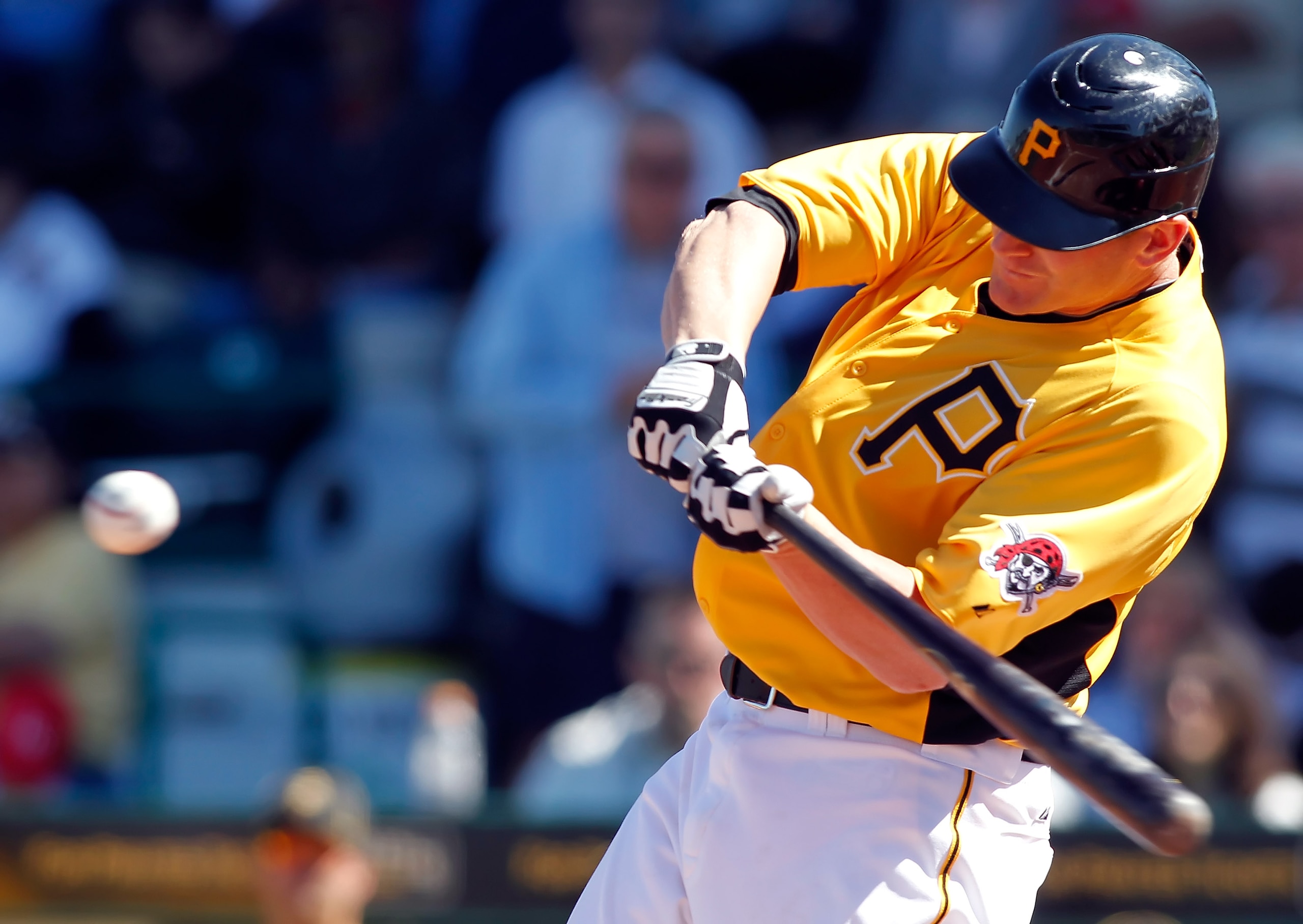 BRADENTON, FL - MARCH 12:  Infielder Lyle Overbay #37 of the Pittsburgh Pirates hits a home run against the Philadelphia Phillies during a Grapefruit League Spring Training Game at McKechnie Field on March 12, 2011 in Bradenton, Florida.  (Photo by J. Mer