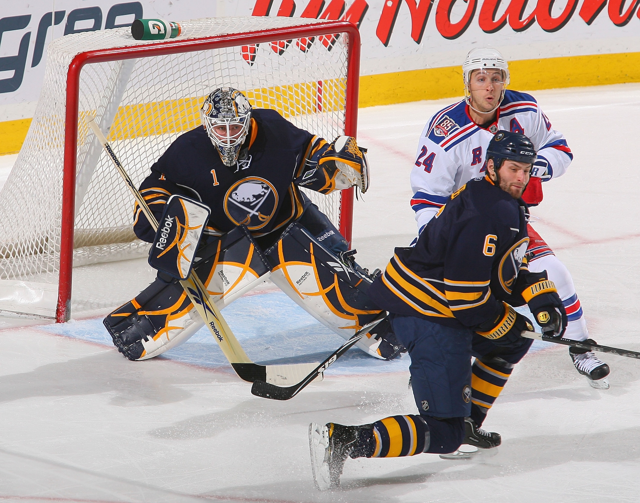 BUFFALO, NY - MARCH 30: Jhonas Enroth #1 and Mike Weber #6  of the Buffalo Sabres defend against Ryan Callahan #24 of the New York Rangers at HSBC Arena on March 30, 2011 in Buffalo, New York.  (Photo by Rick Stewart/Getty Images)