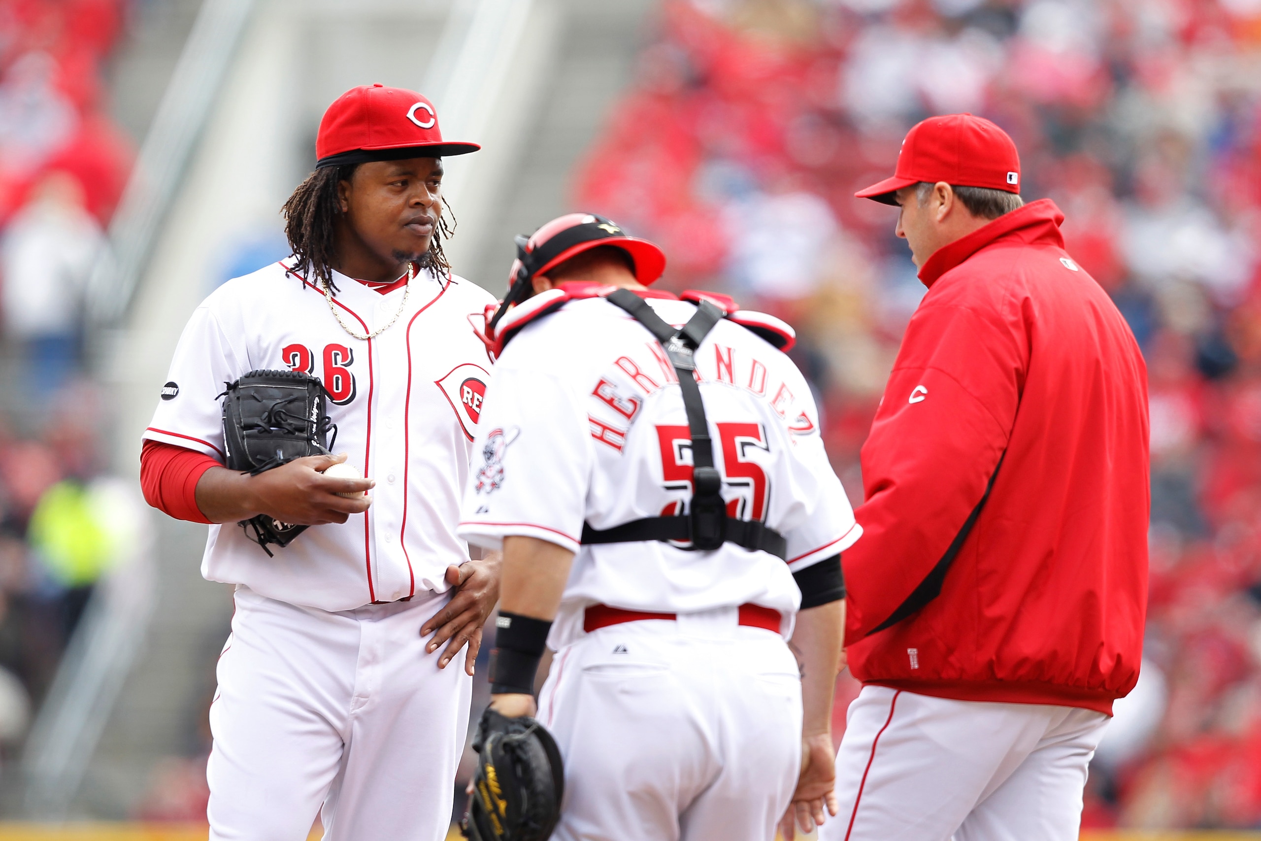 CINCINNATI, OH - MARCH 31: Edinson Volquez #36 of the Cincinnati Reds talks with pitching coach Bryan Price during the opening day game at Great American Ballpark on March 31, 2011 in Cincinnati, Ohio. (Photo by Joe Robbins/Getty Images)