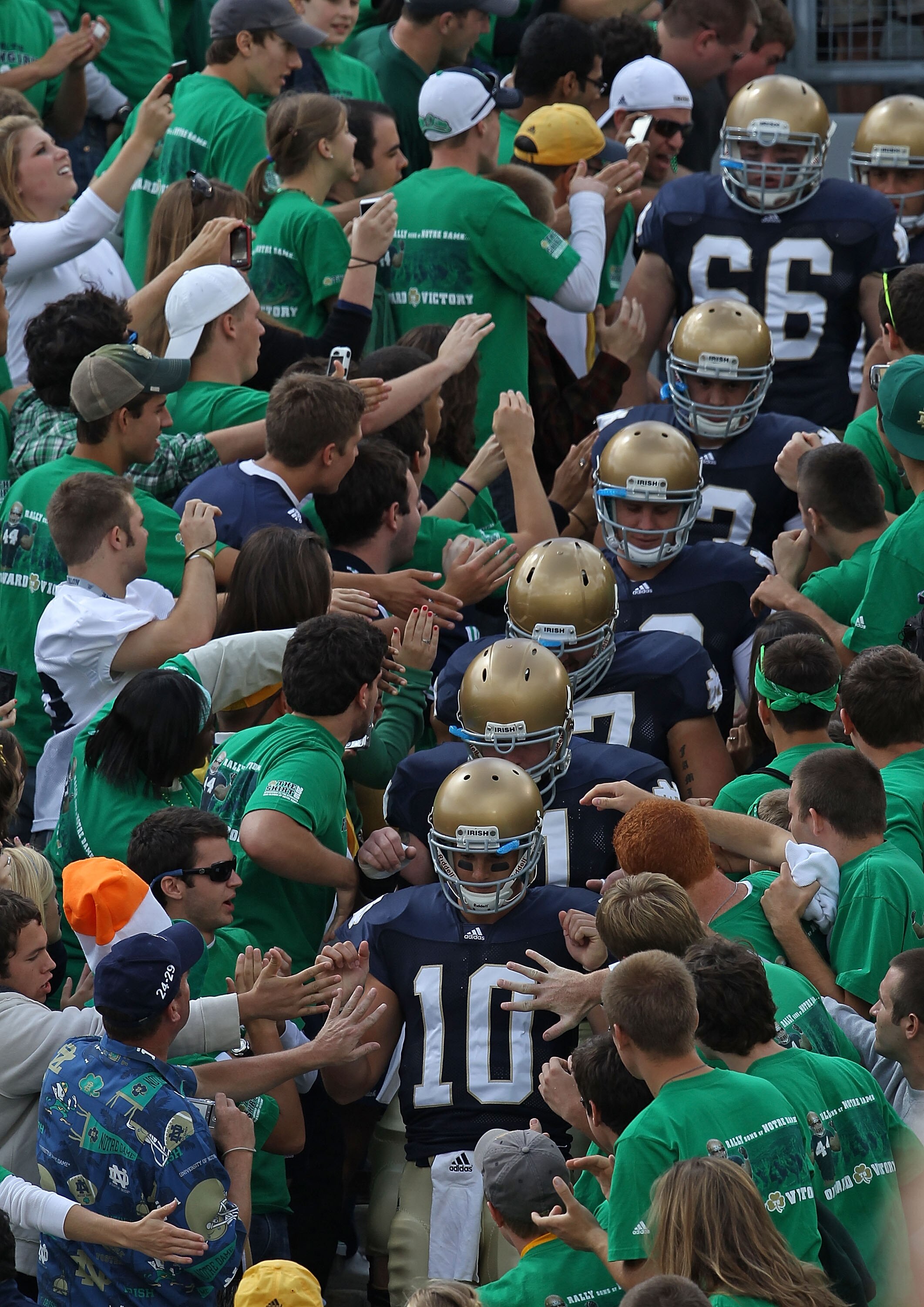 SOUTH BEND, IN - SEPTEMBER 04: Starting quarterback Dayne Crist #10 of the Notre Dame Fighting Irish leads players to the field through the student section for warm-ups before a game against the Purdue Boilermakers at Notre Dame Stadium on September 4, 20