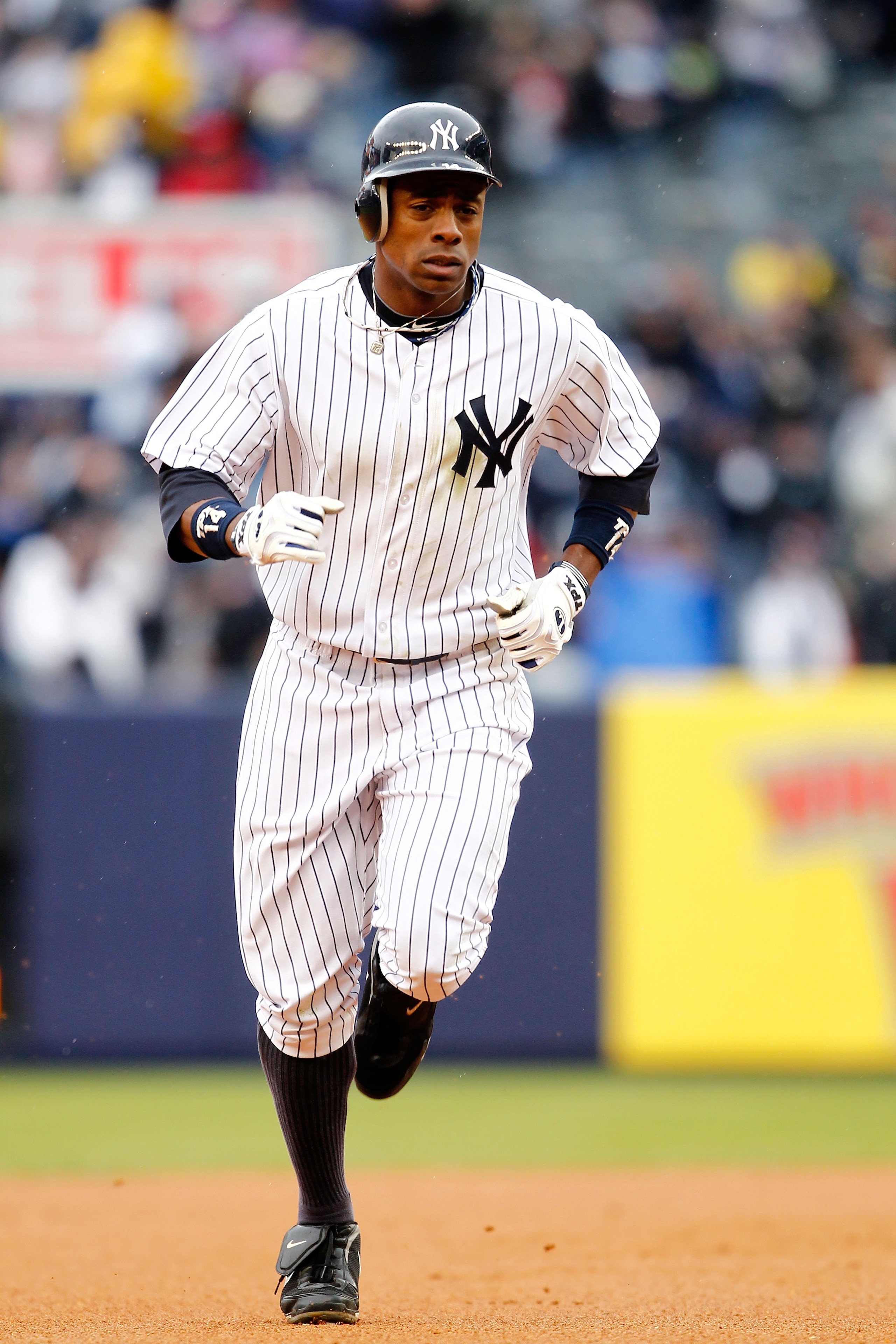 NEW YORK, NY - MARCH 31:  Curtis Granderson #14 of the New York Yankees rounds the bases after hitting a home run to right field in the seventh inning against the Detroit Tigers on Opening Day at Yankee Stadium on March 31, 2011 in the Bronx borough of Ne