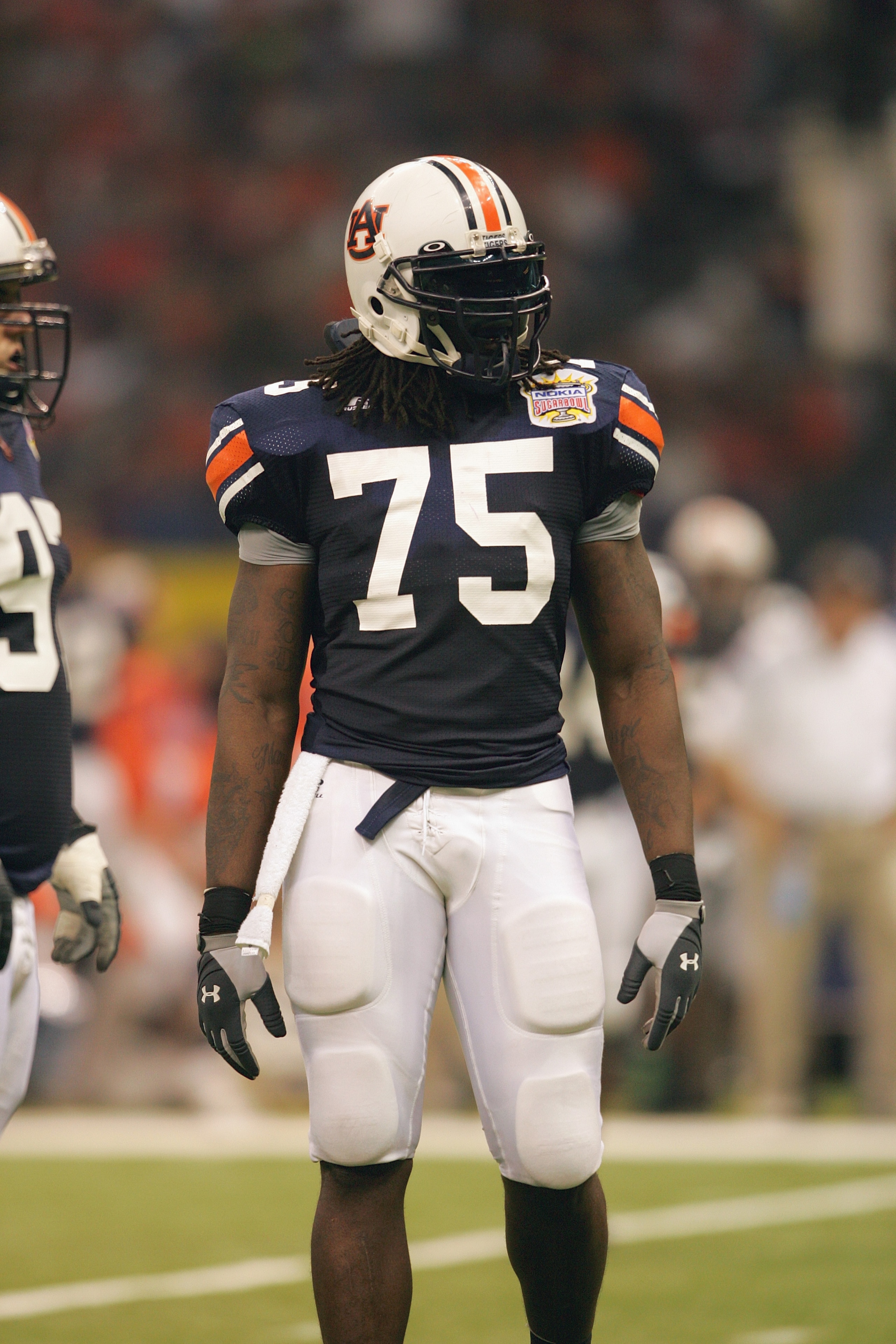 NEW ORLEANS - JANUARY 3: Defensive end Stanley McClover #75 of the Auburn Tigers looks on against the Virginia Tech Hokies during the Nokia Sugar Bowl on January 3, 2005 at the Superdome in New Orleans, Louisiana. The No. 3 Tigers completed a perfect se NEW ORLEANS - JANUARY 3: Defensive end Stanley McClover #75 of the Auburn Tigers looks on against the Virginia Tech Hokies during the Nokia Sugar Bowl on January 3, 2005 at the Superdome in New Orleans, Louisiana. The No. 3 Tigers completed a perfect se
