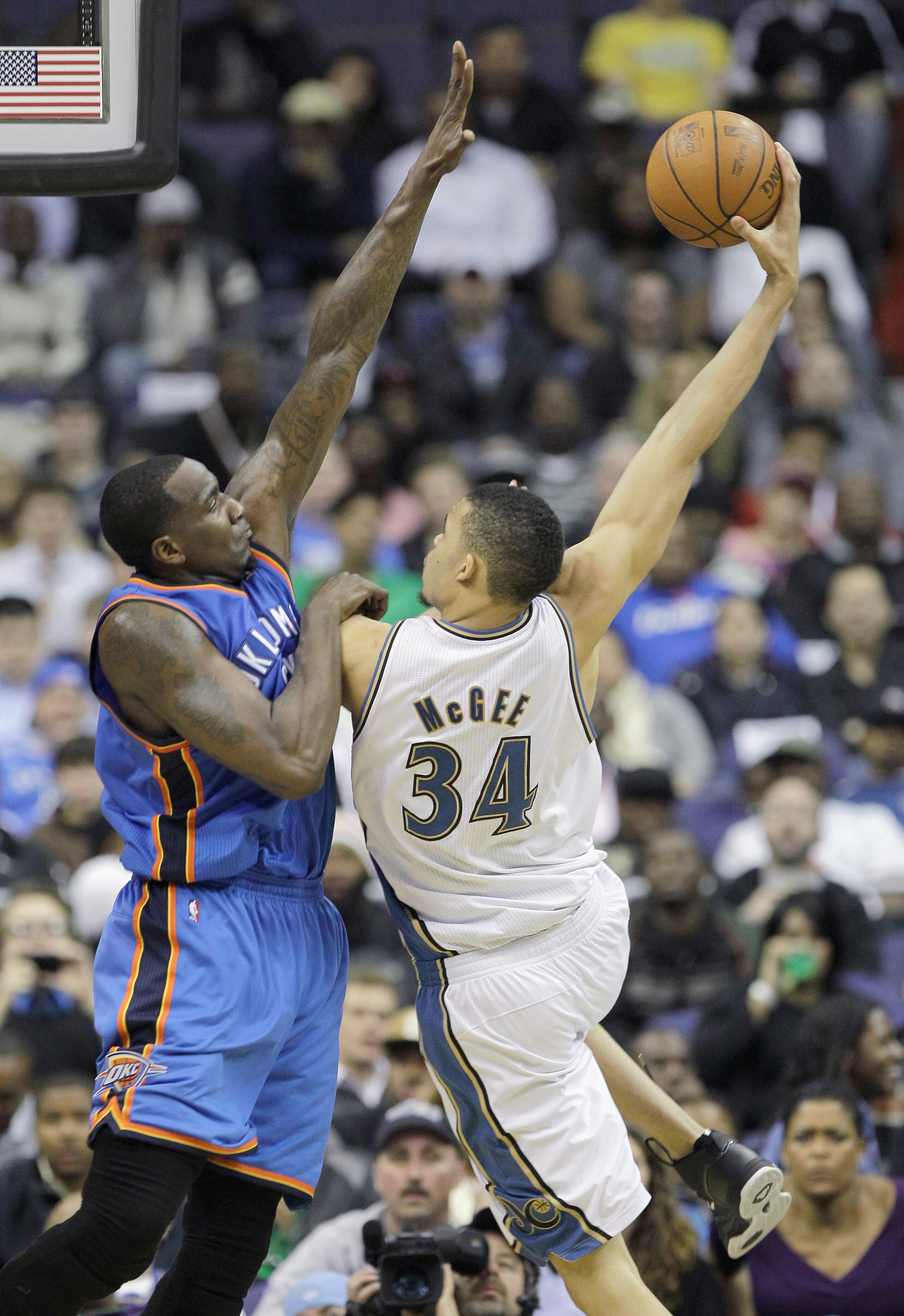 WASHINGTON, DC - MARCH 14: JaVale McGee #34 of the Washington Wizards puts up a shot in front of Kendrick Perkins #5 of the Oklahoma City Thunder during the first half at the Verizon Center on March 14, 2011 in Washington, DC. NOTE TO USER: User expressly
