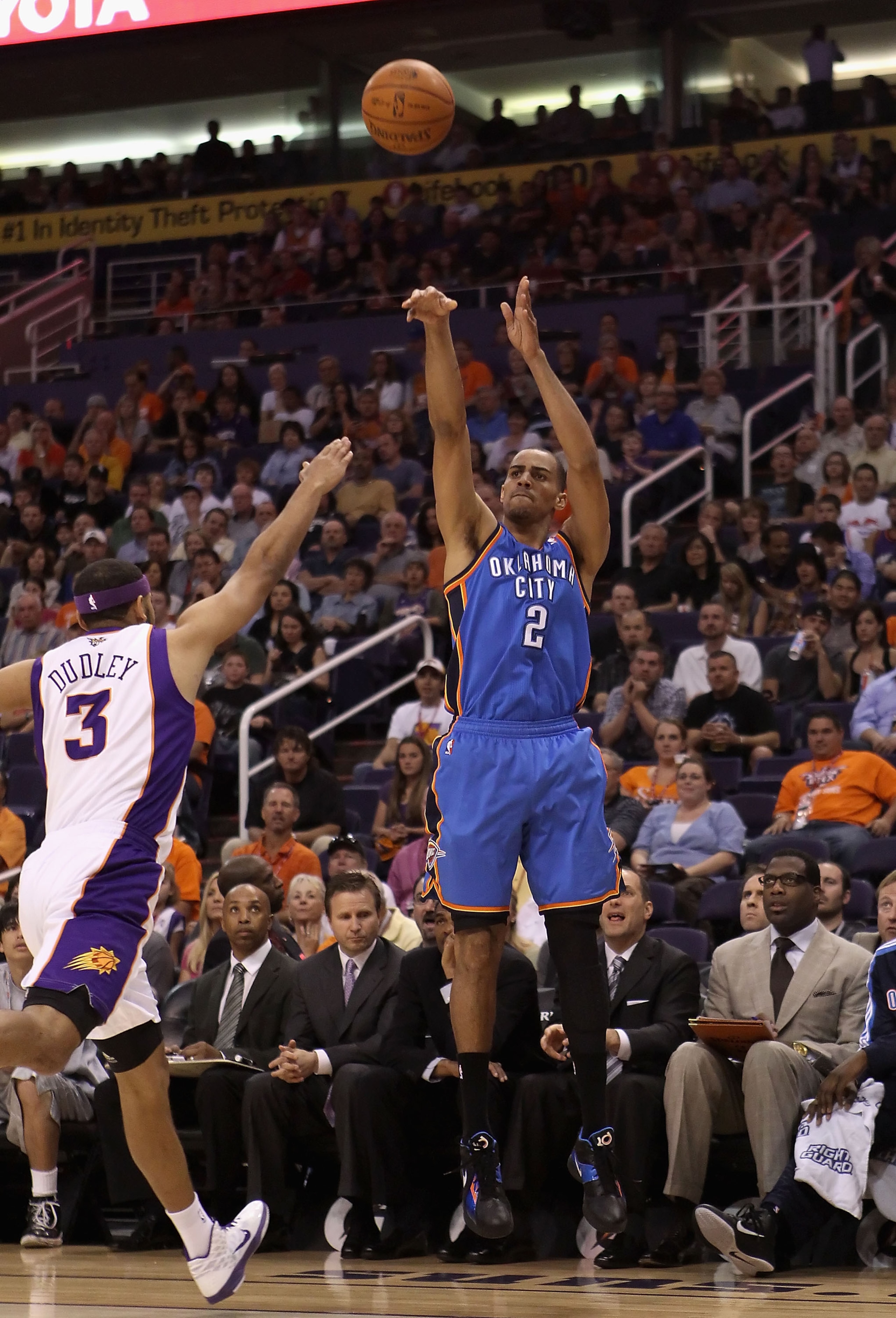 PHOENIX, AZ - MARCH 30:  Thabo Sefolosha #2 of the Oklahoma City Thunder puts up a shot over Jared Dudley #3 of the Phoenix Suns during the NBA game at US Airways Center on March 30, 2011 in Phoenix, Arizona.  NOTE TO USER: User expressly acknowledges and