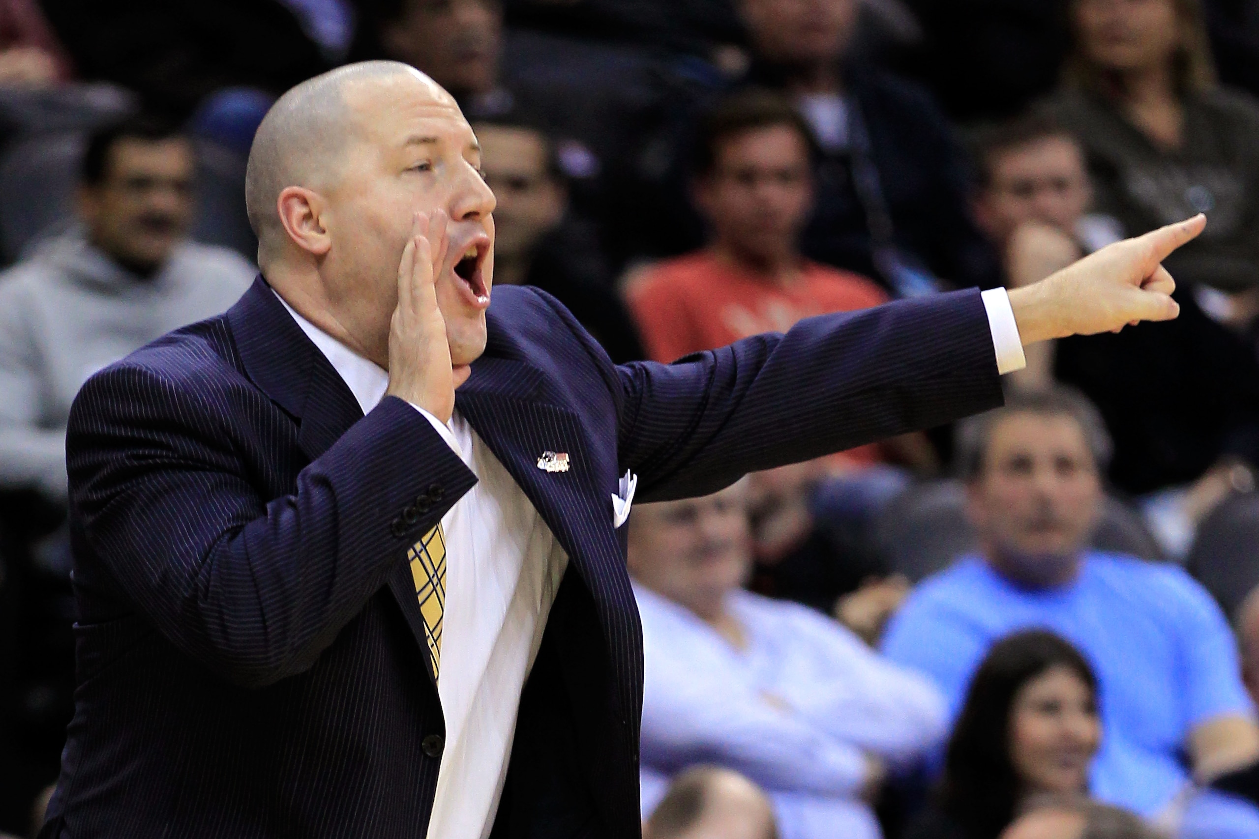 NEWARK, NJ - MARCH 25:  Head coach Buzz Williams of the Marquette Golden Eagles reacts after a play against the North Carolina Tar Heels during the first half the east regional semifinal of the 2011 NCAA Men's Basketball Tournament at the Prudential Cente