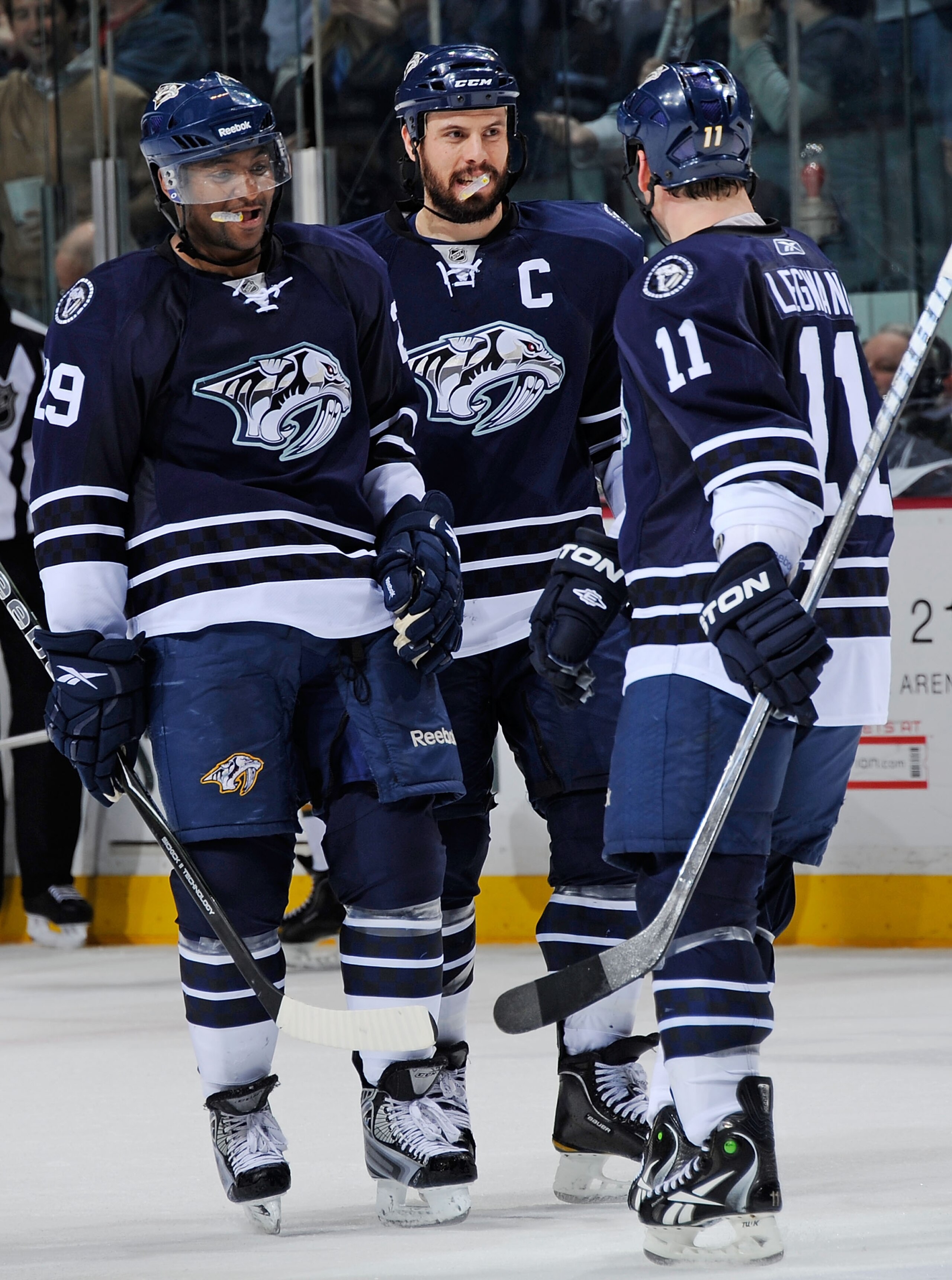 NASHVILLE, TN - MARCH 26:  Joel Ward #29 and Shea Weber #6 of the Nashville Predators congratulate teammate David Legwand #11 on scoring an open net goal against the Dallas Stars on March 26, 2011 at the Bridgestone Arena in Nashville, Tennessee.  (Photo