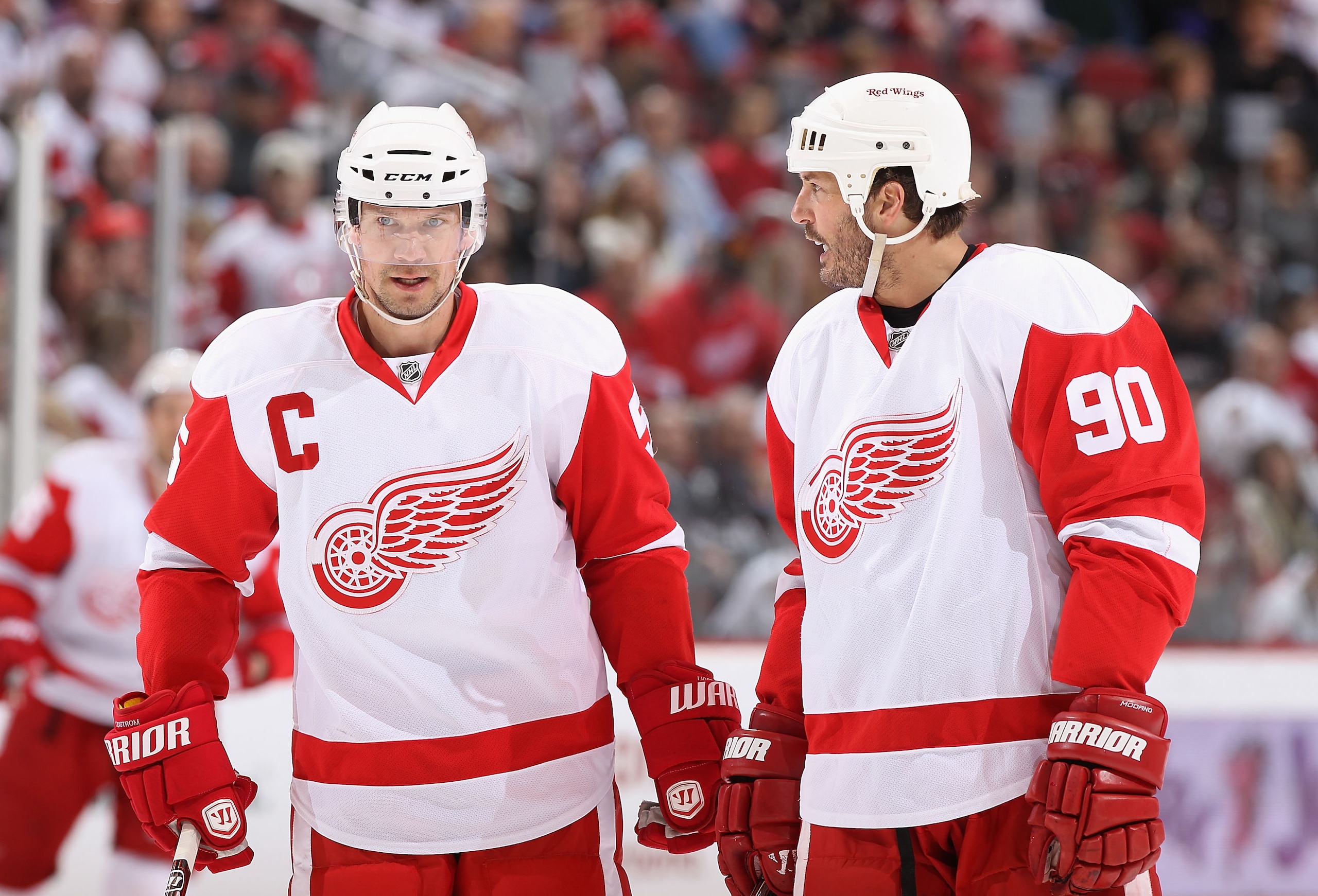 GLENDALE, AZ - MARCH 05:  Nicklas Lidstrom #5 and Mike Modano #90 of the Detroit Red Wings talk during the NHL game against the Phoenix Coyotes at Jobing.com Arena on March 5, 2011 in Glendale, Arizona. The Coyotes defeated the Red Wings 5-4 in an overtim