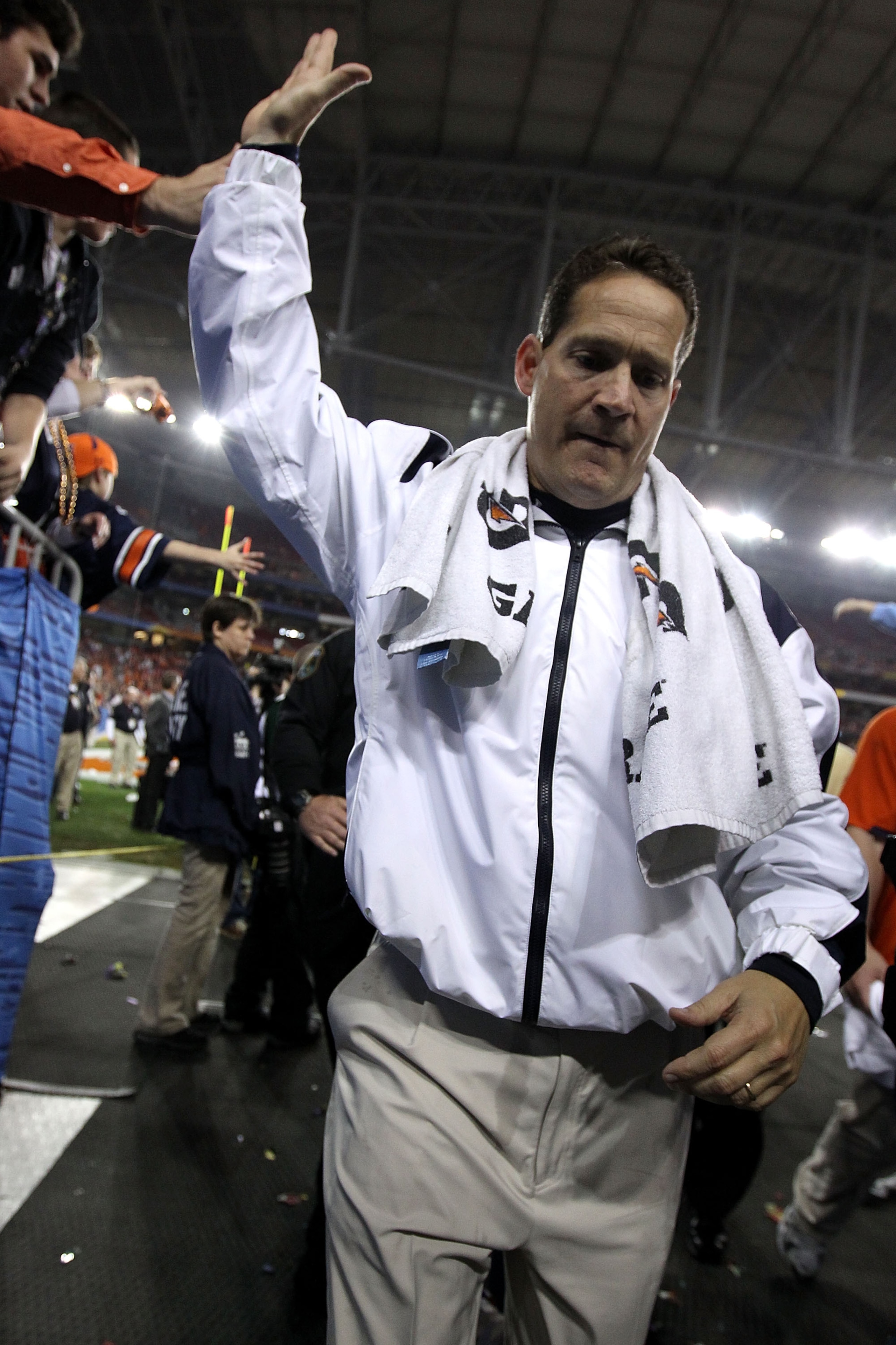 GLENDALE, AZ - JANUARY 10: Head coach Gene Chizik of the Auburn Tigers celebrates the Tigers 22-19 victory as he holds up the Coaches Trophy after defeating the Oregon Ducks during the Tostitos BCS National Championship Game at University of Phoenix Stad GLENDALE, AZ - JANUARY 10: Head coach Gene Chizik of the Auburn Tigers celebrates the Tigers 22-19 victory as he holds up the Coaches Trophy after defeating the Oregon Ducks during the Tostitos BCS National Championship Game at University of Phoenix Stad