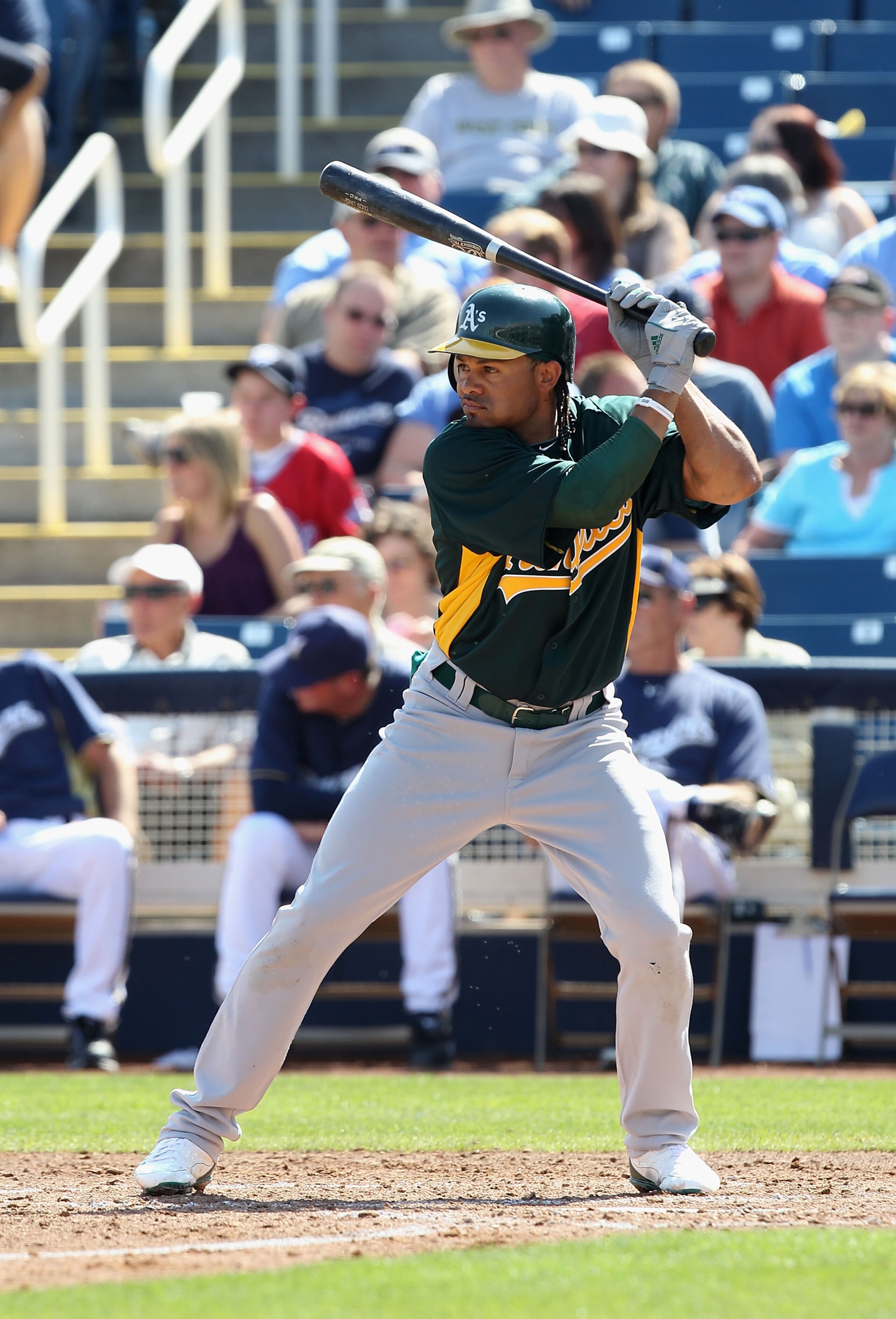 PHOENIX, AZ - MARCH 03:  Coco Crisp #4 of the Oakland Athletics bats against the Milwaukee Brewers during the spring training game at Maryvale Baseball Park on March 3, 2011 in Phoenix, Arizona.  (Photo by Christian Petersen/Getty Images)