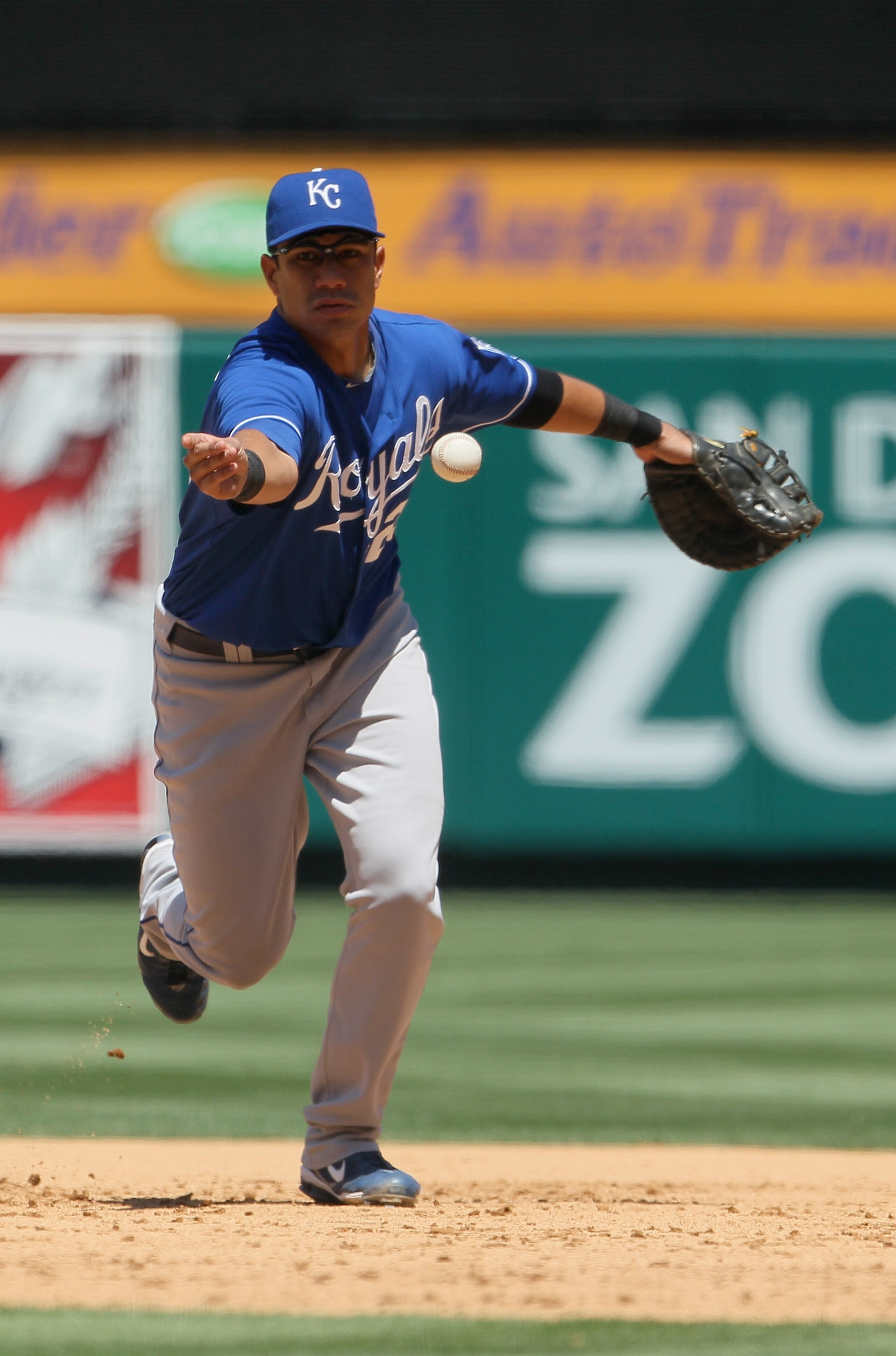 ANAHEIM, CA - AUGUST 11:  Kila Ka'aihue #25 of the Kansas City Royals tosses the ball to first base against the Los Angeles Angels of Anaheim at Angel Stadium on August 11, 2010 in Anaheim, California.  (Photo by Jeff Gross/Getty Images)