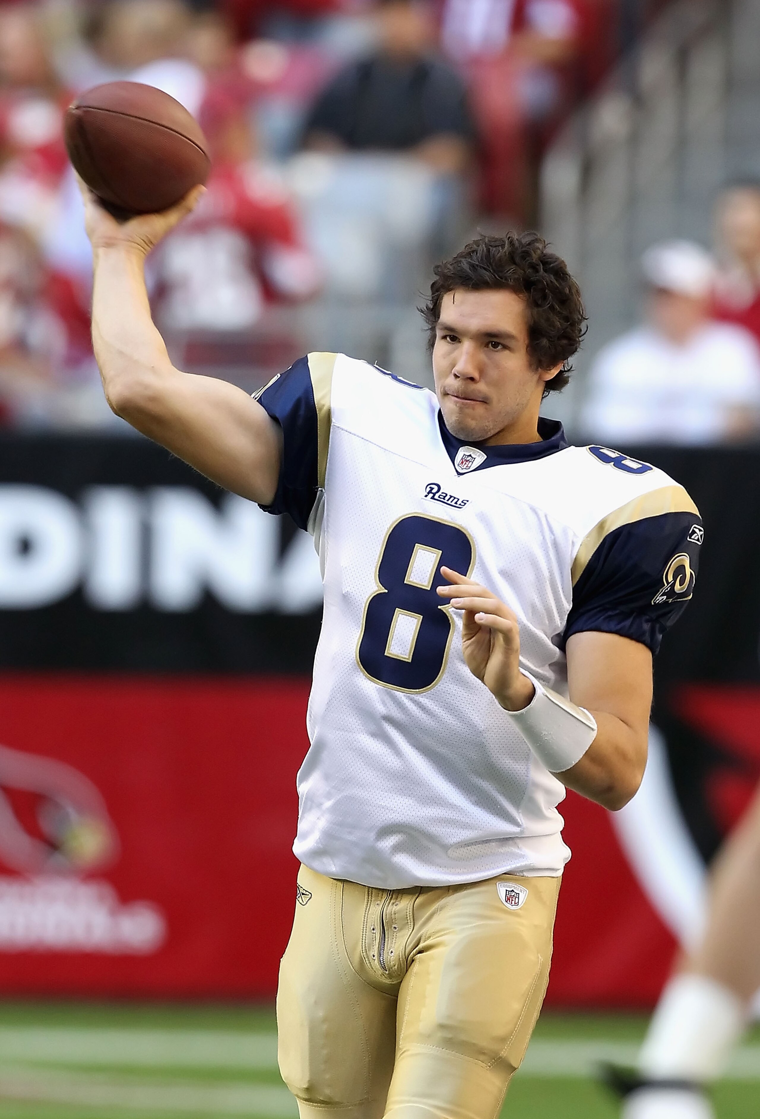 GLENDALE, AZ - DECEMBER 05:  Quarterback Sam Bradford #8 of the St. Louis Rams warms up before the NFL game against the Arizona Cardinals at the University of Phoenix Stadium on December 5, 2010 in Glendale, Arizona. The Rams defeated the Cardinals 19-6.