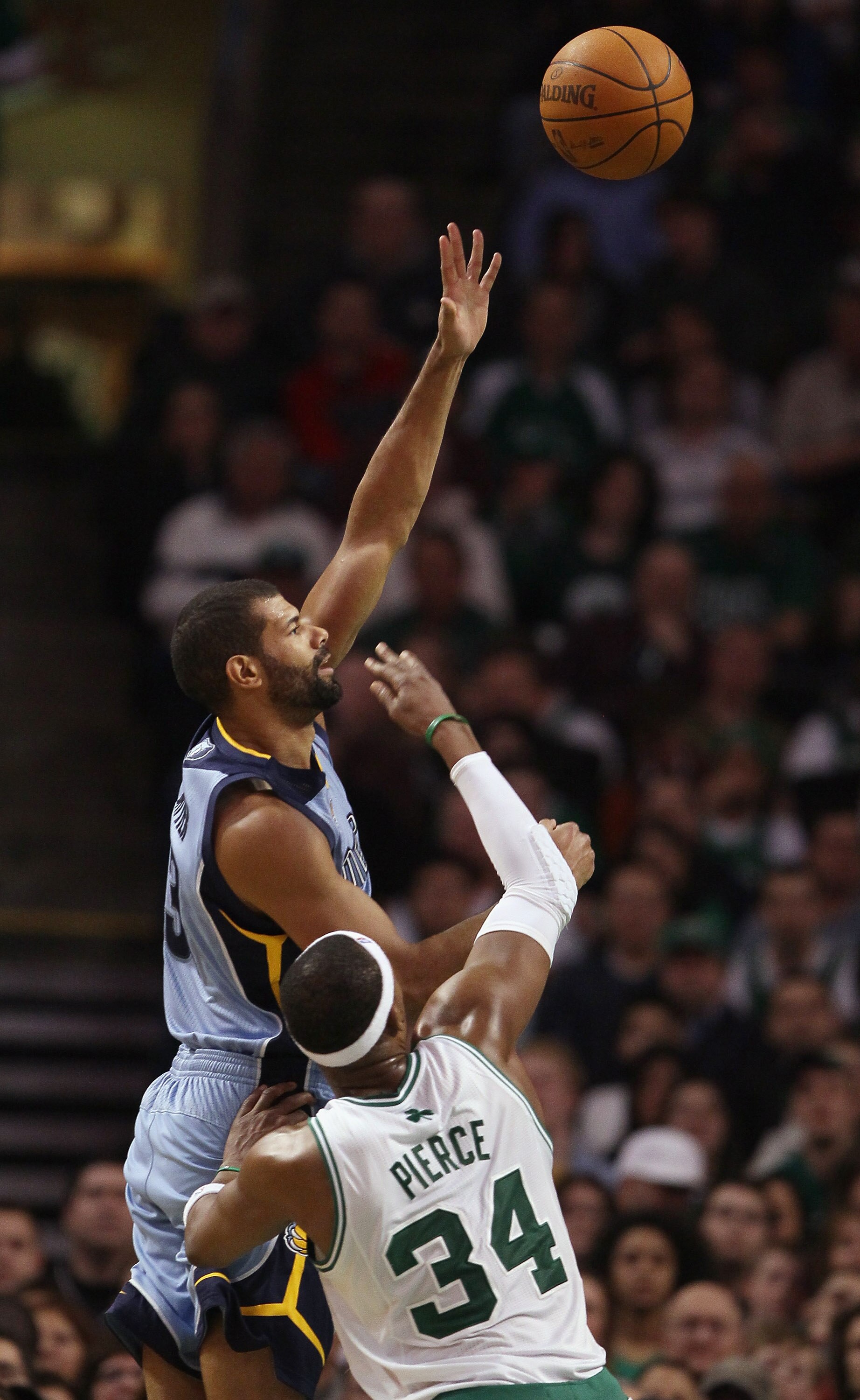 BOSTON, MA - MARCH 23:  Shane Battier #31 of the Memphis Grizzlies shoots over Paul Pierce #34 of the Boston Celtics on March 23, 2011 at the TD Garden in Boston, Massachusetts.  The Memphis Grizzlies defeated the Boston Celtics 90-87. NOTE TO USER: User