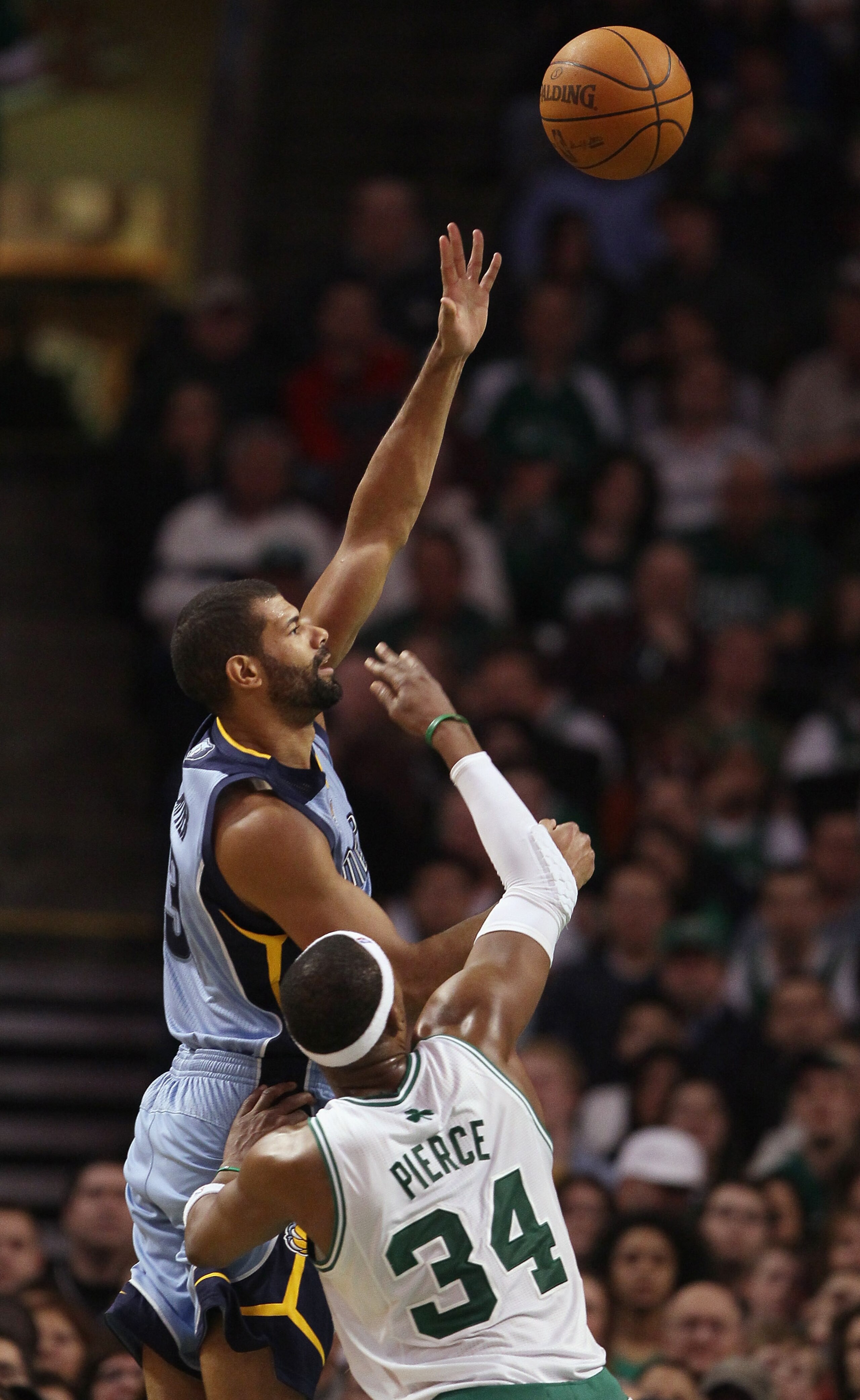 BOSTON, MA - MARCH 23:  Shane Battier #31 of the Memphis Grizzlies shoots over Paul Pierce #34 of the Boston Celtics on March 23, 2011 at the TD Garden in Boston, Massachusetts.  The Memphis Grizzlies defeated the Boston Celtics 90-87. NOTE TO USER: User