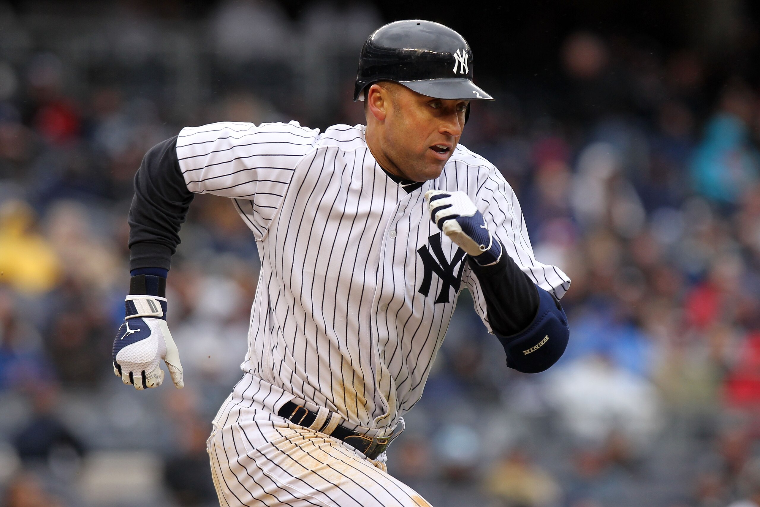 NEW YORK, NY - MARCH 31:  Derek Jeter #2 of the New York Yankees runs to base in the fifth inning of the game against the Detroit Tigers on Opening Day at Yankee Stadium on March 31, 2011 in the Bronx borough of New York City.  (Photo by Nick Laham/Getty