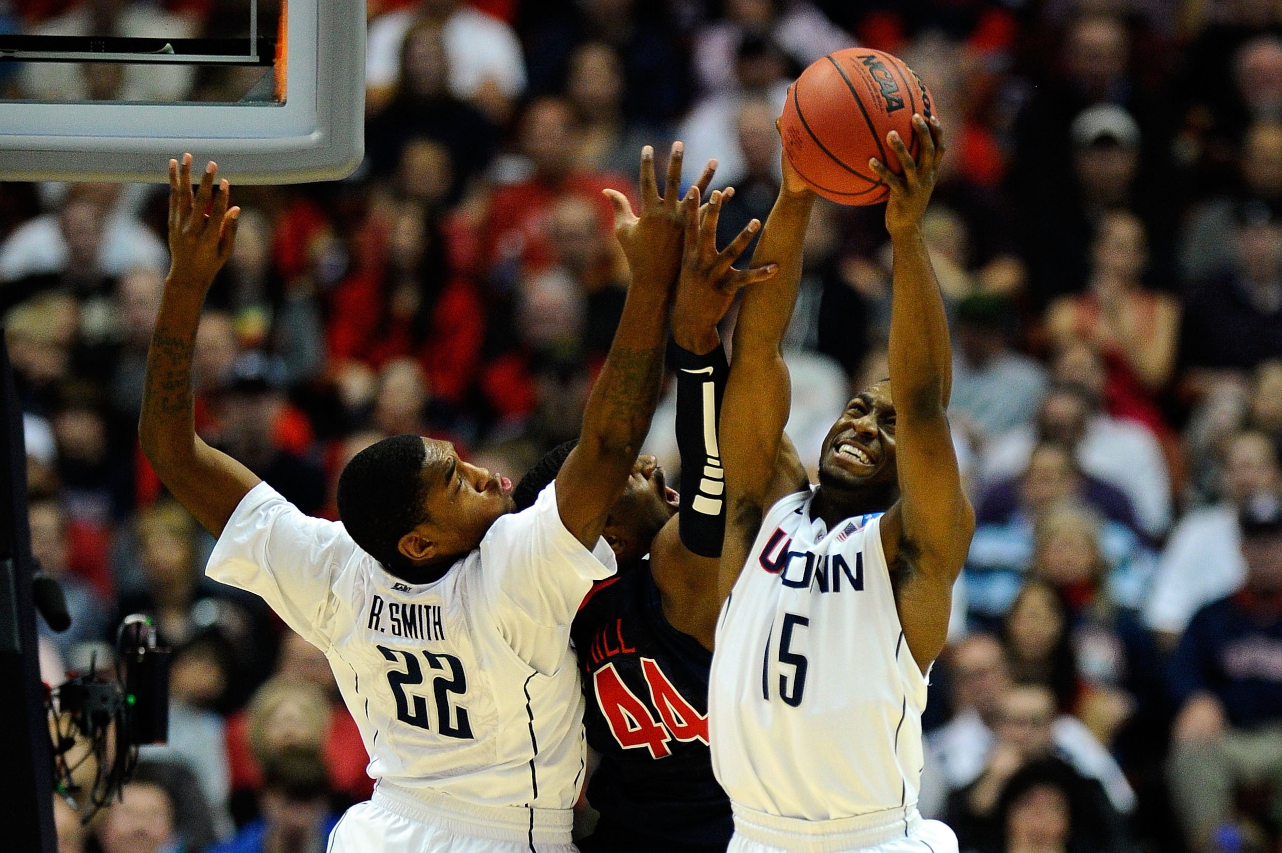 ANAHEIM, CA - MARCH 26: Kemba Walker #15 and Roscoe Smith #22 of the Connecticut Huskies go up for a rebound against Derrick Williams #23 of the Arizona Wildcats during the west regional final of the 2011 NCAA men's basketball tournament at the Honda Cen ANAHEIM, CA - MARCH 26: Kemba Walker #15 and Roscoe Smith #22 of the Connecticut Huskies go up for a rebound against Derrick Williams #23 of the Arizona Wildcats during the west regional final of the 2011 NCAA men's basketball tournament at the Honda Cen