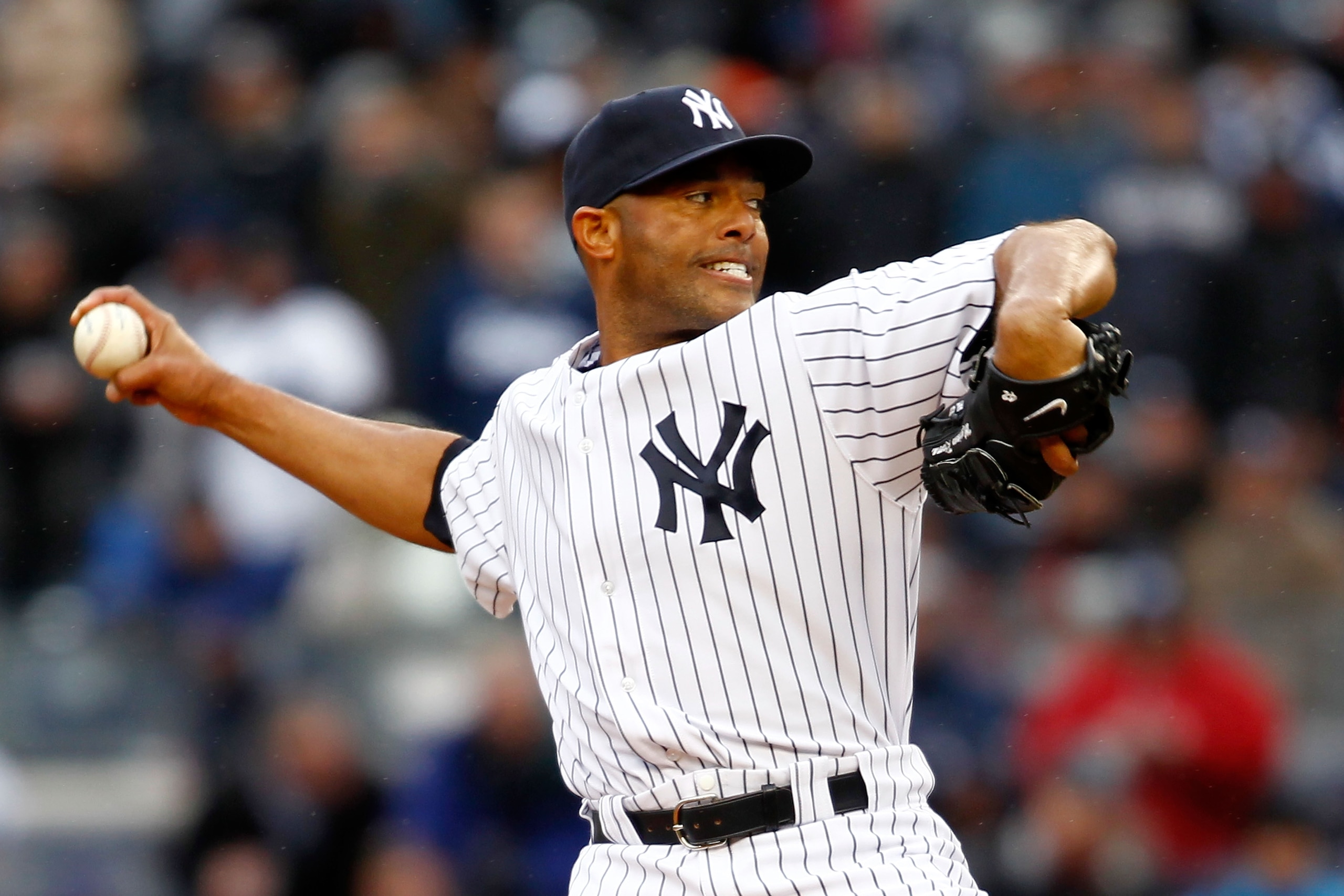 NEW YORK, NY - MARCH 31:  Mariano Rivera #42 of the New York Yankees pitches against the Detroit Tigers in the ninth inning on Opening Day at Yankee Stadium on March 31, 2011 in the Bronx borough of New York City. The Yankees won 6-3 in the ninth inning.
