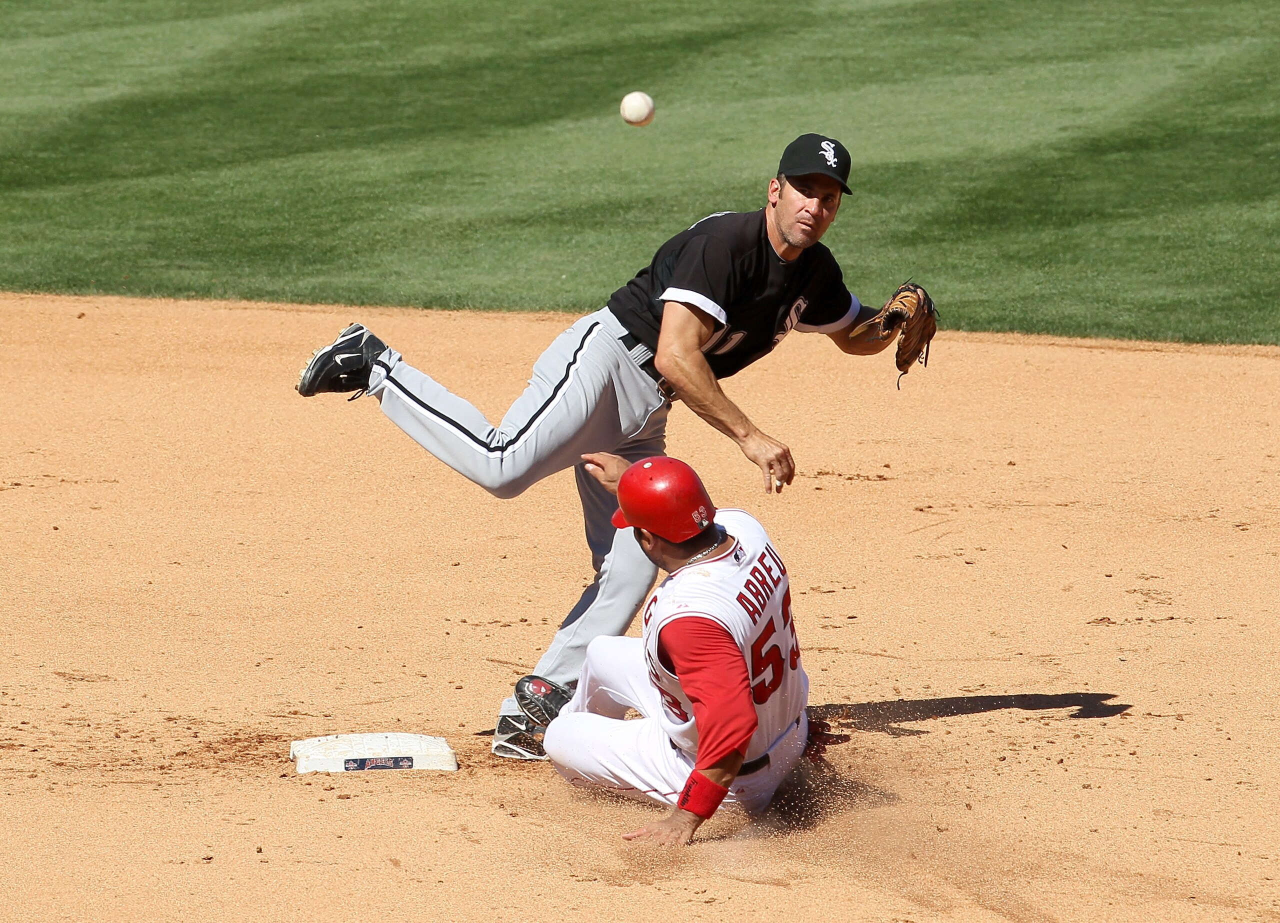 ANAHEIM, CA - SEPTEMBER 26:  Second baseman Omar Vizquel #11 of the Chicago White Sox throws to first to complete a double play after forcing out Bobby Abreu #53 of the Los Angeles Angels of Anaheim to end the fifth inning on September 26, 2010 at Angel S