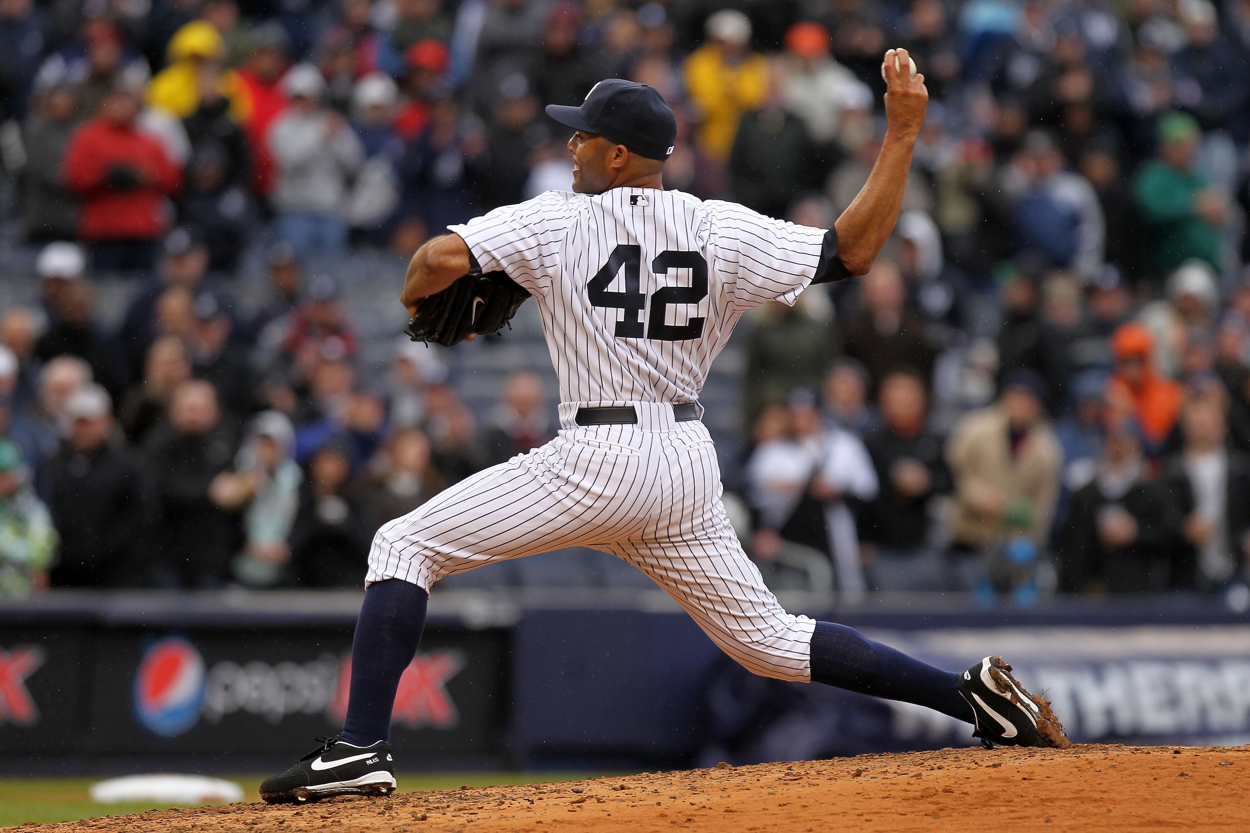 NEW YORK, NY - MARCH 31:  Mariano Rivera #42 of the New York Yankees pitches against the Detroit Tigers in the ninth inning on Opening Day at Yankee Stadium on March 31, 2011 in the Bronx borough of New York City.  (Photo by Nick Laham/Getty Images)