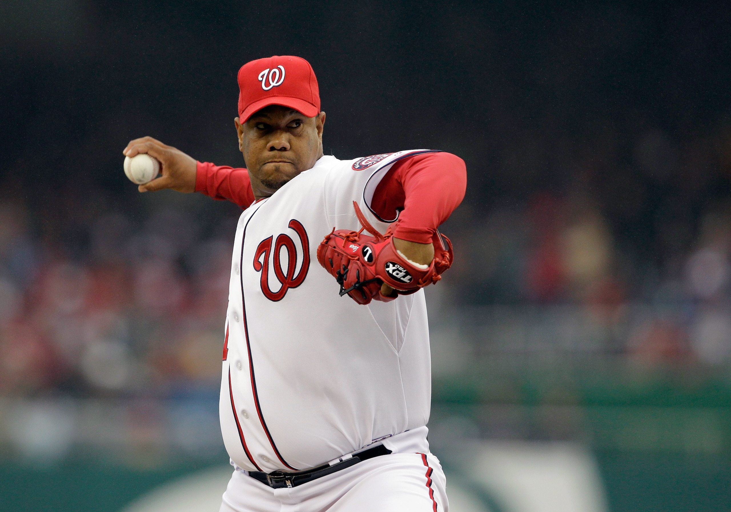 WASHINGTON, DC - MARCH 31:  Starting pitcher Livan Hernandez #61 of the Washington Nationals delivers to an Atlanta Braves batter during the third inning at Nationals Park on March 31, 2011 in Washington, DC.  (Photo by Rob Carr/Getty Images)