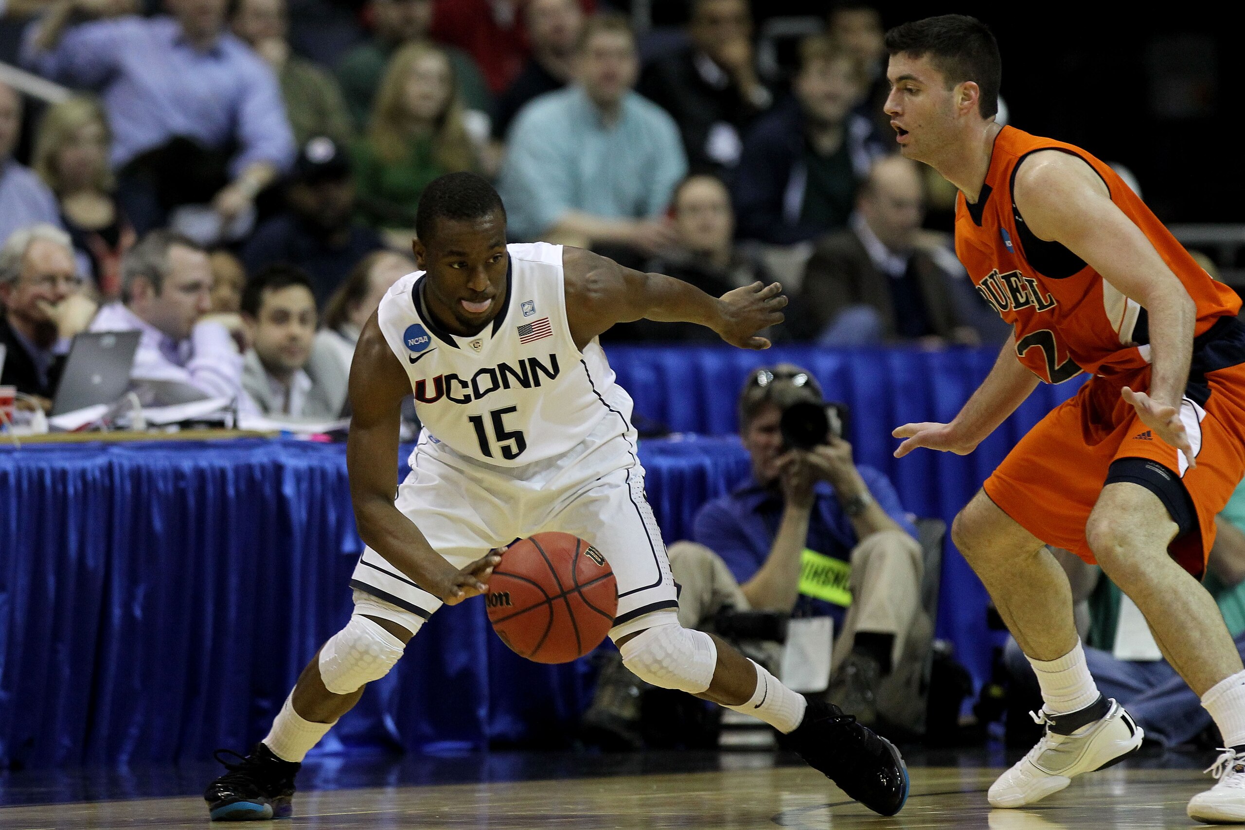 WASHINGTON - MARCH 17: Kemba Walker #15 of the Connecticut Huskies dribbles around Bryan Cohen #22 of the Bucknell Bison during the second round of the 2011 NCAA men's basketball tournament at the Verizon Center on March 17, 2011 in Washington, DC. (Pho WASHINGTON - MARCH 17: Kemba Walker #15 of the Connecticut Huskies dribbles around Bryan Cohen #22 of the Bucknell Bison during the second round of the 2011 NCAA men's basketball tournament at the Verizon Center on March 17, 2011 in Washington, DC. (Pho