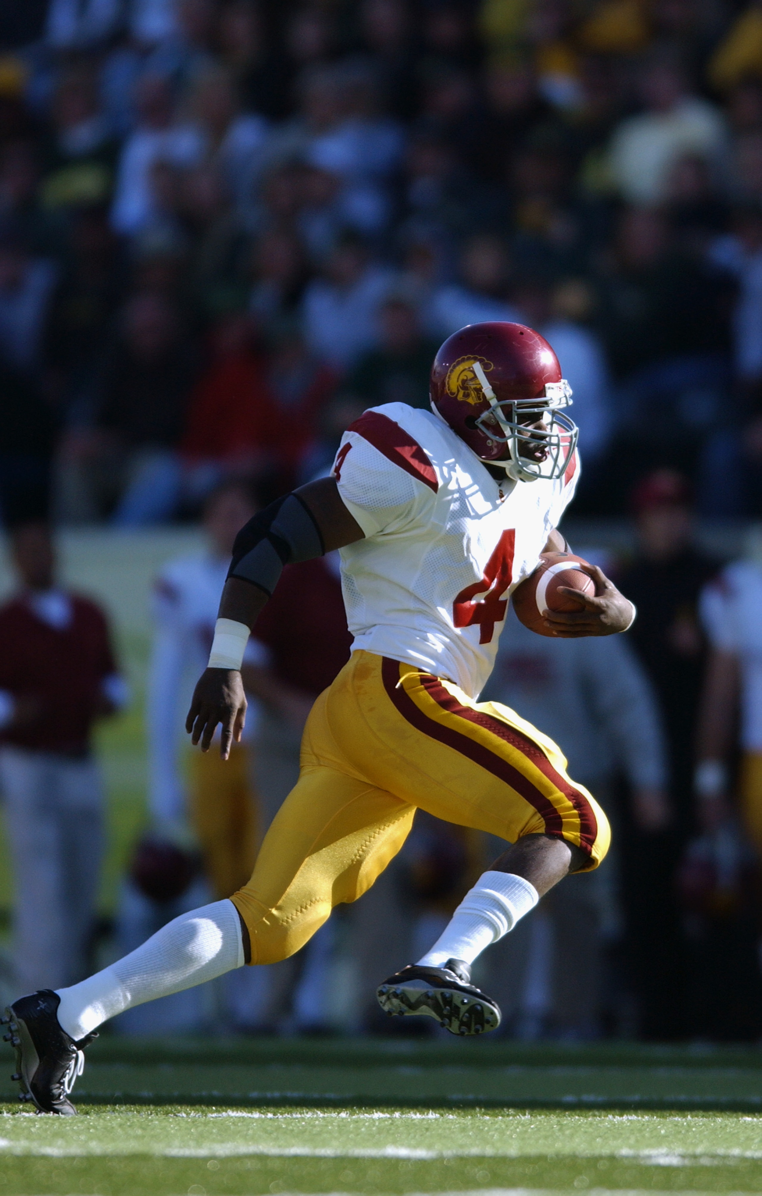 EUGENE - OCTOBER 26:  Tail back Sultan McCullough #4 of the USC Trojans runs for yards during the game against the Oregon Ducks at Autzen Stadium on October 26, 2002 in Eugene, Oregon. USC defeated Oregon 44-33.  (Photo by Otto Greule Jr/Getty Images)