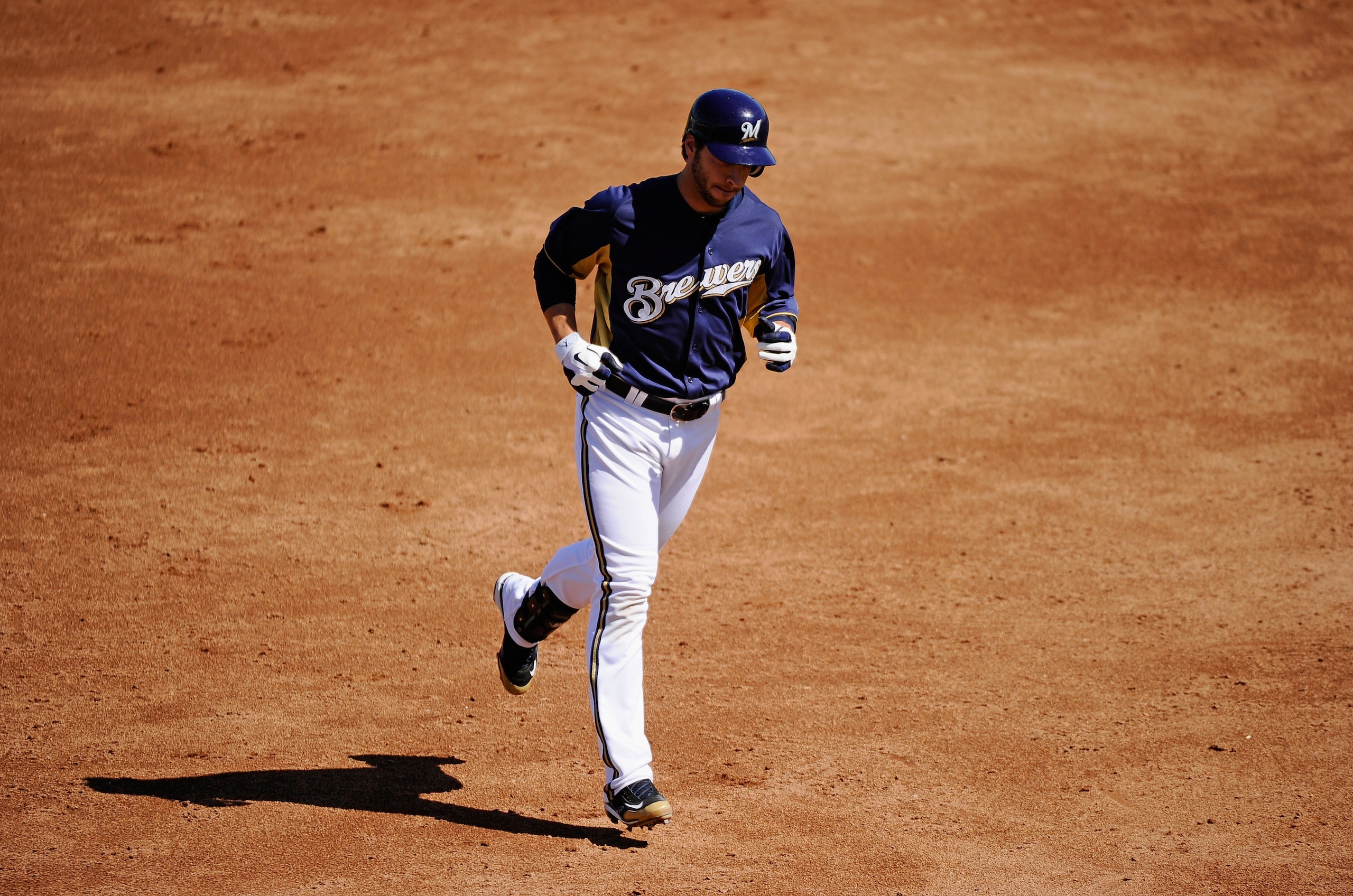 PHOENIX, AZ - MARCH 10:  Ryan Braun #8 of the Milwaukee Brewers runs the bases after hitting a three-run home run against the Colorado Rockies in the third inning of the spring training baseball game at Maryvale Baseball Park on March 10, 2011 in Phoenix,