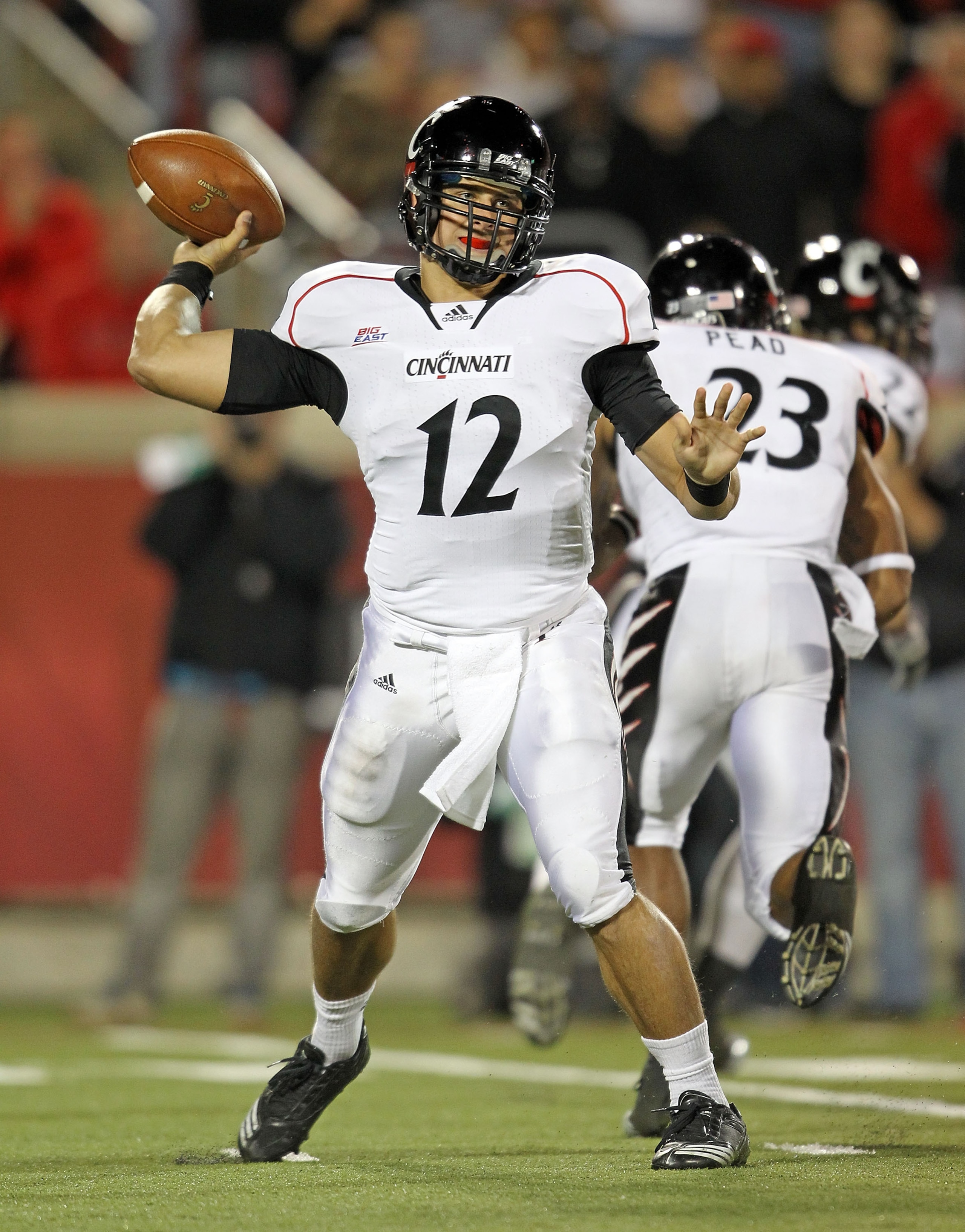 LOUISVILLE, KY - OCTOBER 15:  Zach Collaros #12 of the Cincinnati Bearcats throws a pass during the Big East Conference game against the Louisville Cardinals at Papa John's Cardinal Stadium on October 15, 2010 in Louisville, Kentucky.  (Photo by Andy Lyon